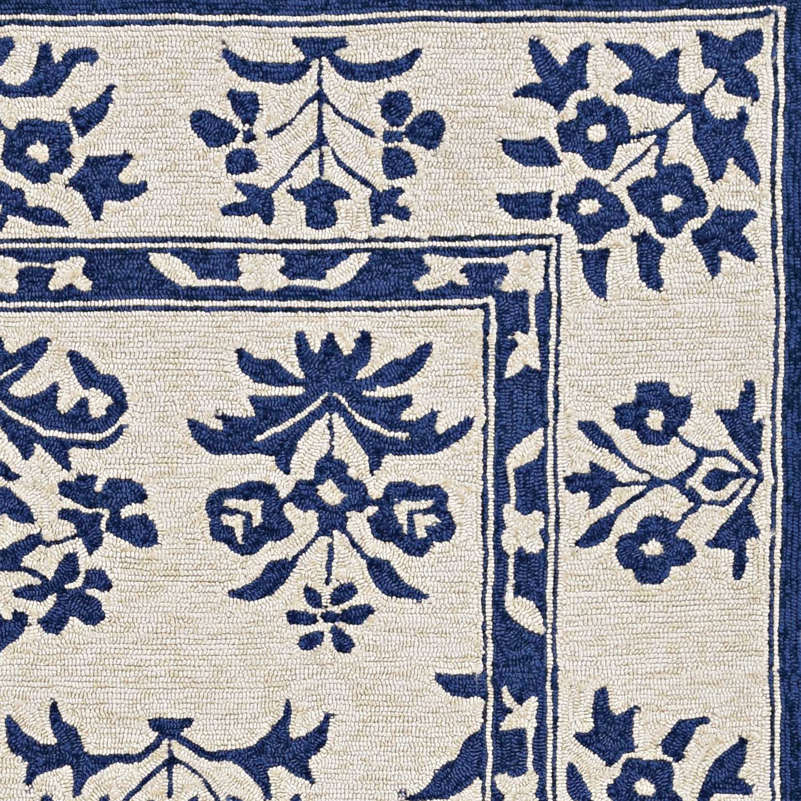 5x7 sand and blue floral bordered area rug, perfect for indoor and outdoor use, showcasing a beautiful floral design.