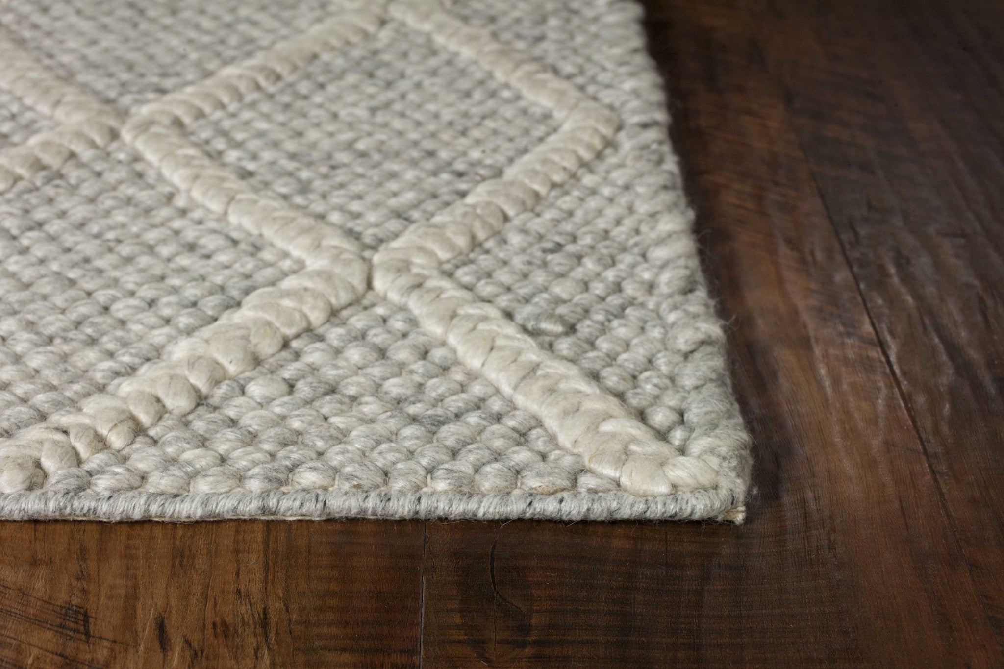 5x7 wool grey area rug featuring a diamond pattern, perfect for contemporary home decor.