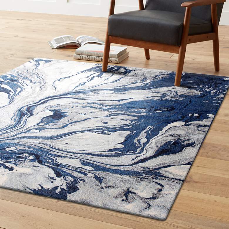 A beautiful blue watercolor indoor area rug measuring 5x8 inches, showcasing vibrant colors and a contemporary design, perfect for enhancing home decor.