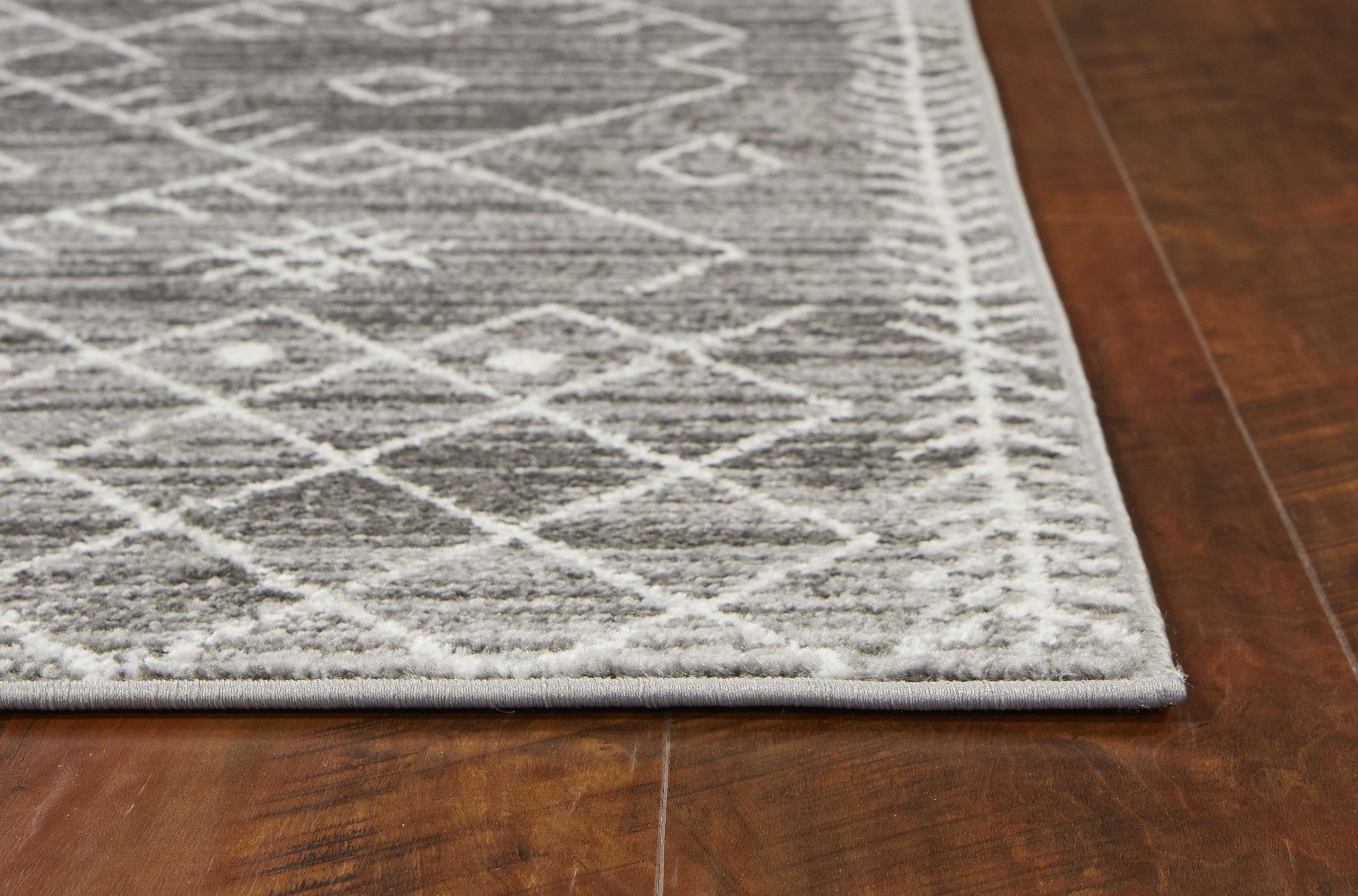 5x8 gray and white boho geometric area rug with intricate patterns, perfect for modern decor.