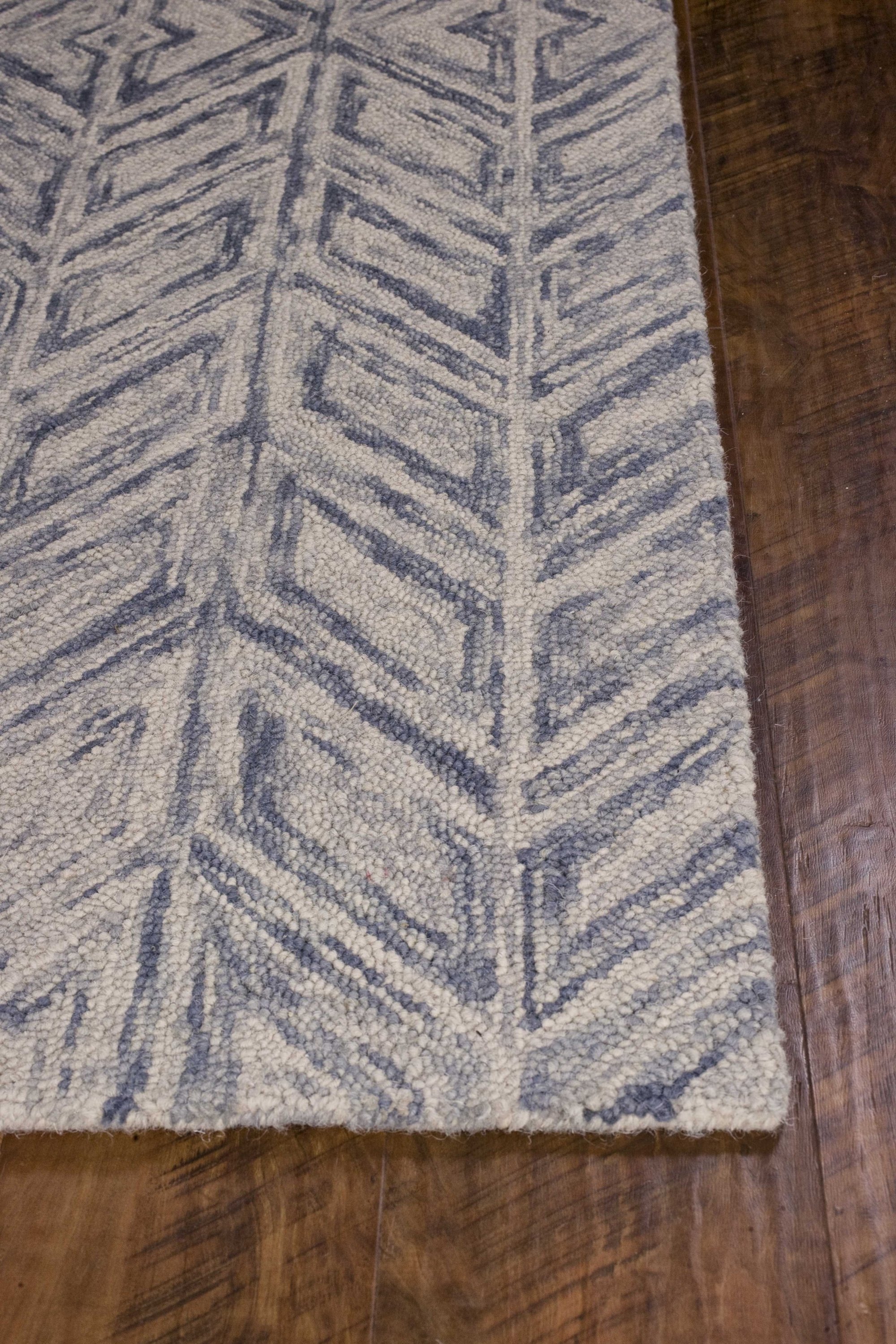 5x7 inches blue hand-tufted wool herringbone indoor area rug showcasing elegant design and quality craftsmanship.