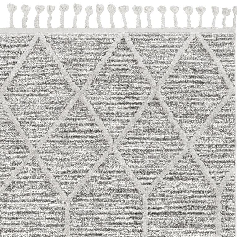 5x8 inches ivory grey machine woven abstract rug with fringe, showcasing a contemporary design perfect for indoor spaces.