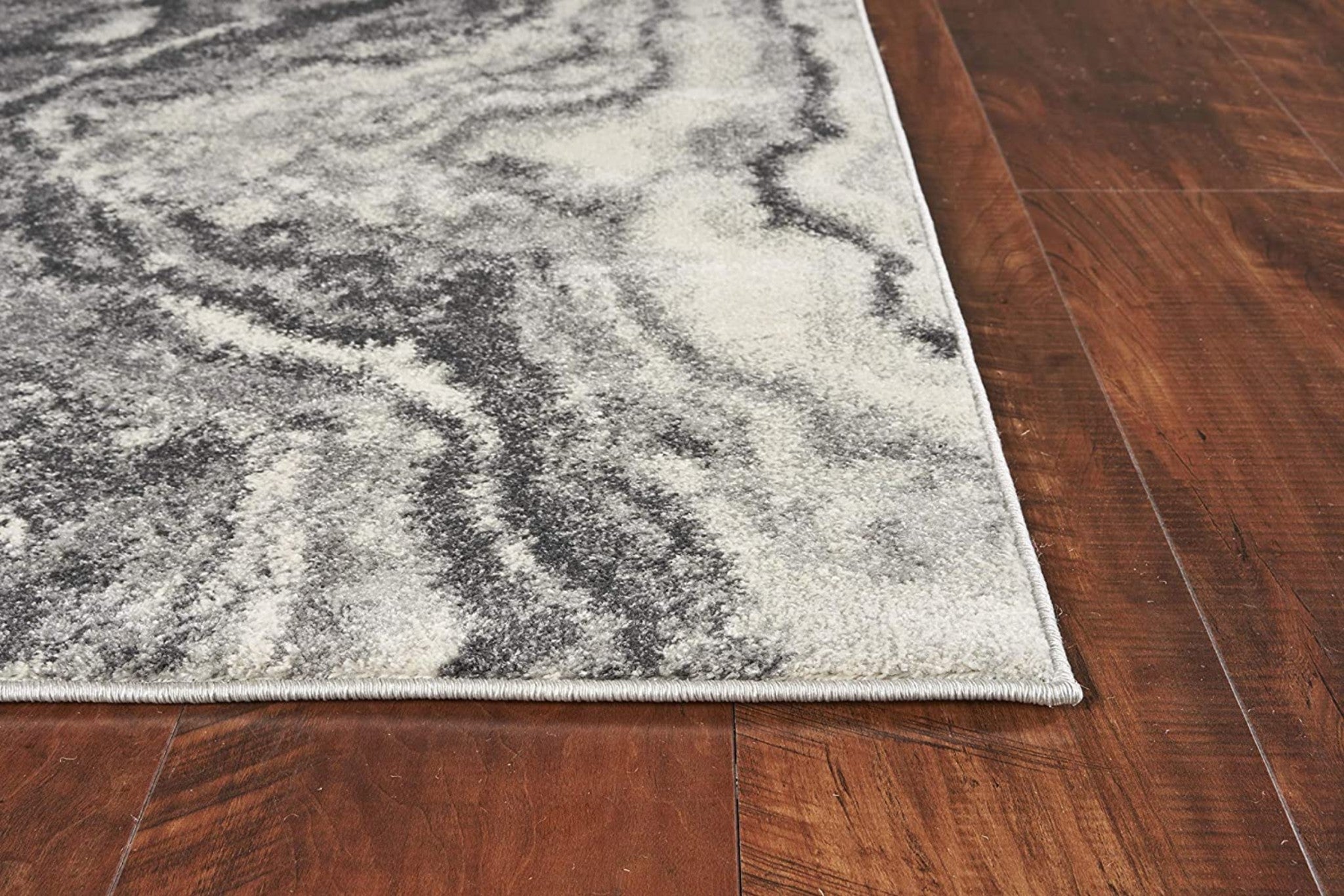 5x8 Ivory Grey Machine Woven Marble Indoor Area Rug featuring abstract watercolor patterns and soft texture.