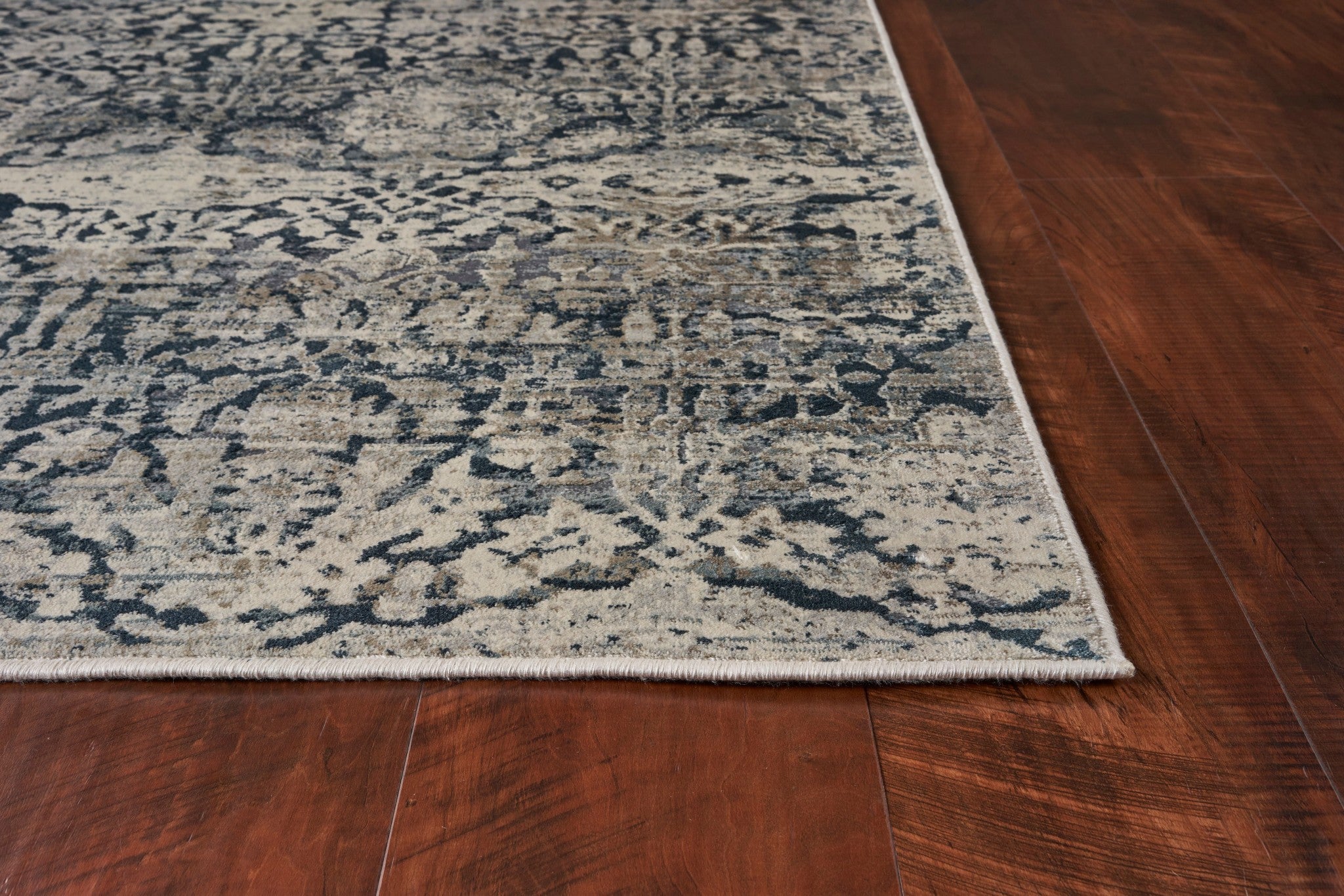 5x8 teal machine woven distressed floral traditional rug with metallic accents, showcasing elegant patterns and a low pile height.