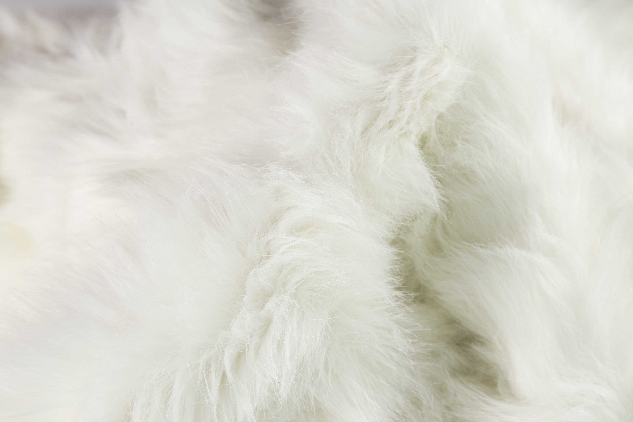 Luxurious off white faux sheepskin area rug measuring 60x72 inches, showcasing a plush texture and contemporary design.