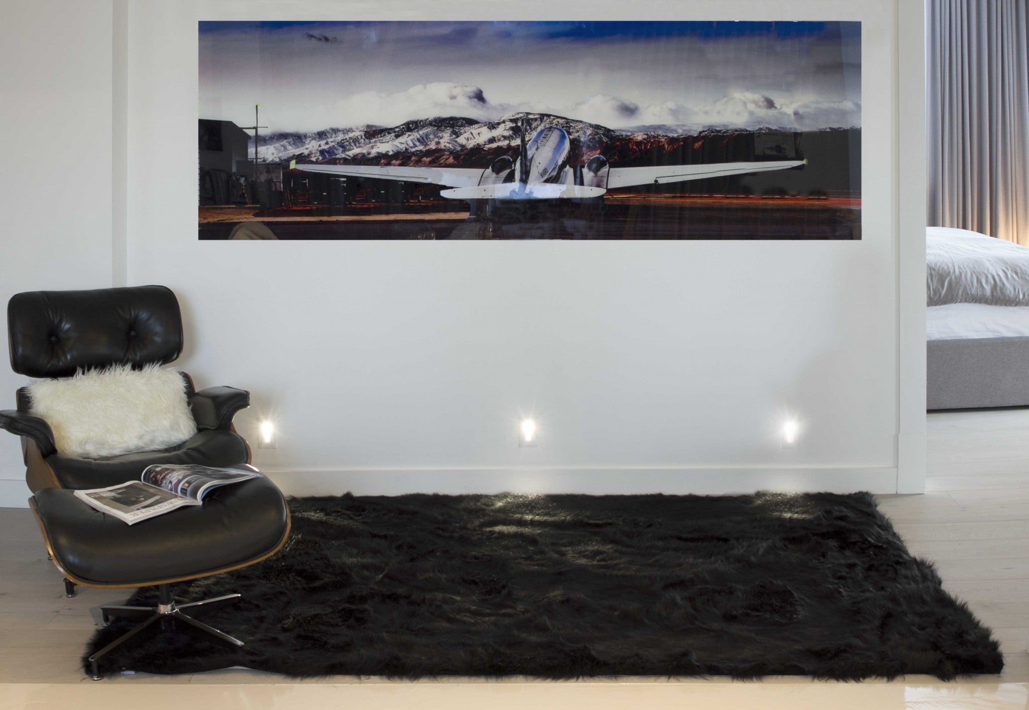 Luxurious 60x96 inches black sheepskin rug or throw, showcasing plush texture and elegant design, perfect for home decor.