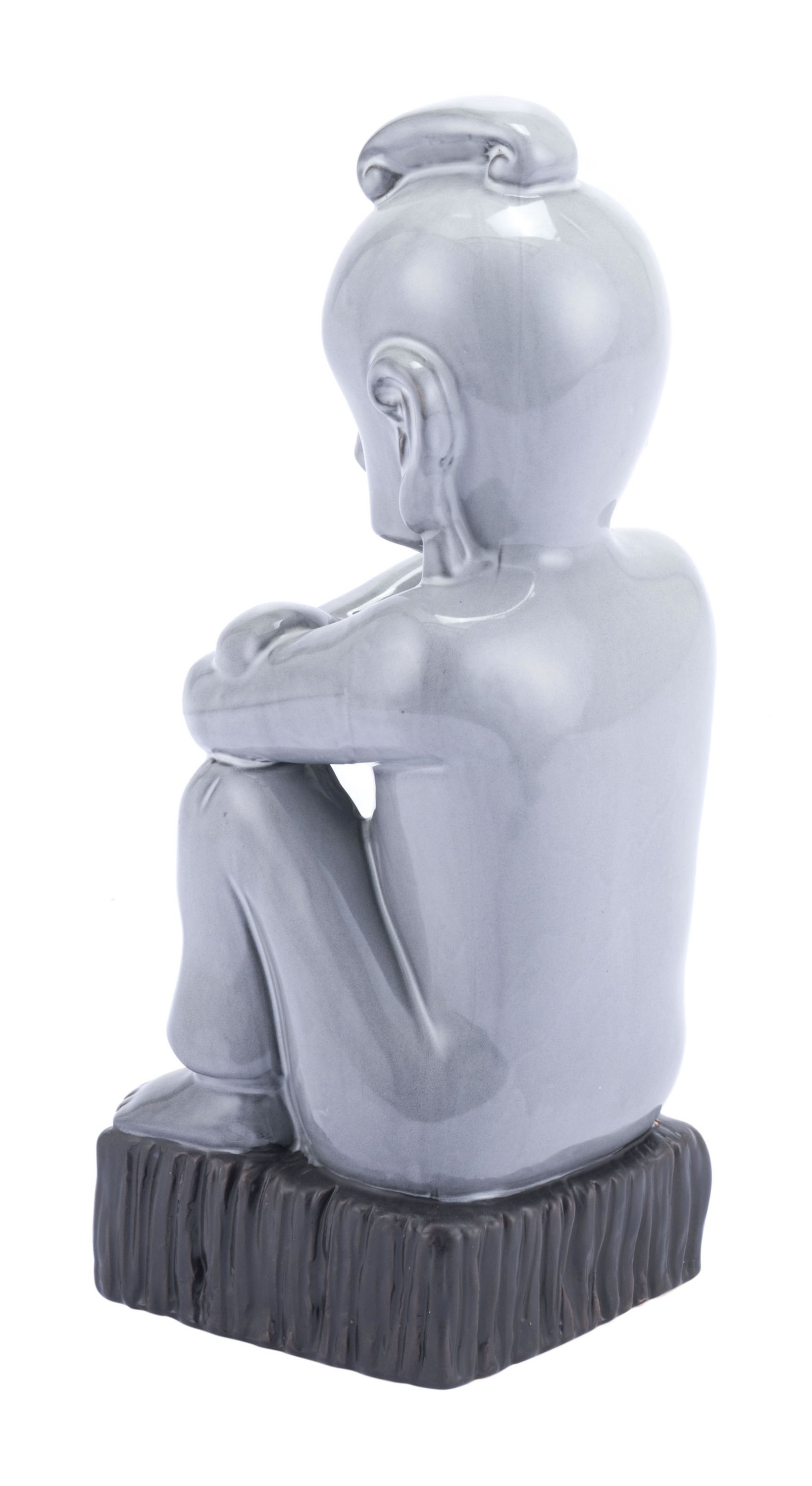 A tall gray ceramic figurine with a glossy finish and a matte black base, symbolizing nature and elegance.