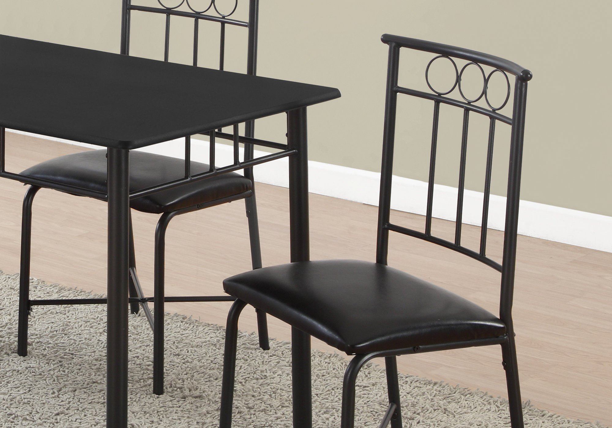 Elegant black metal dining set with foam polyurethane seats, designed for modern interiors, seating five comfortably.