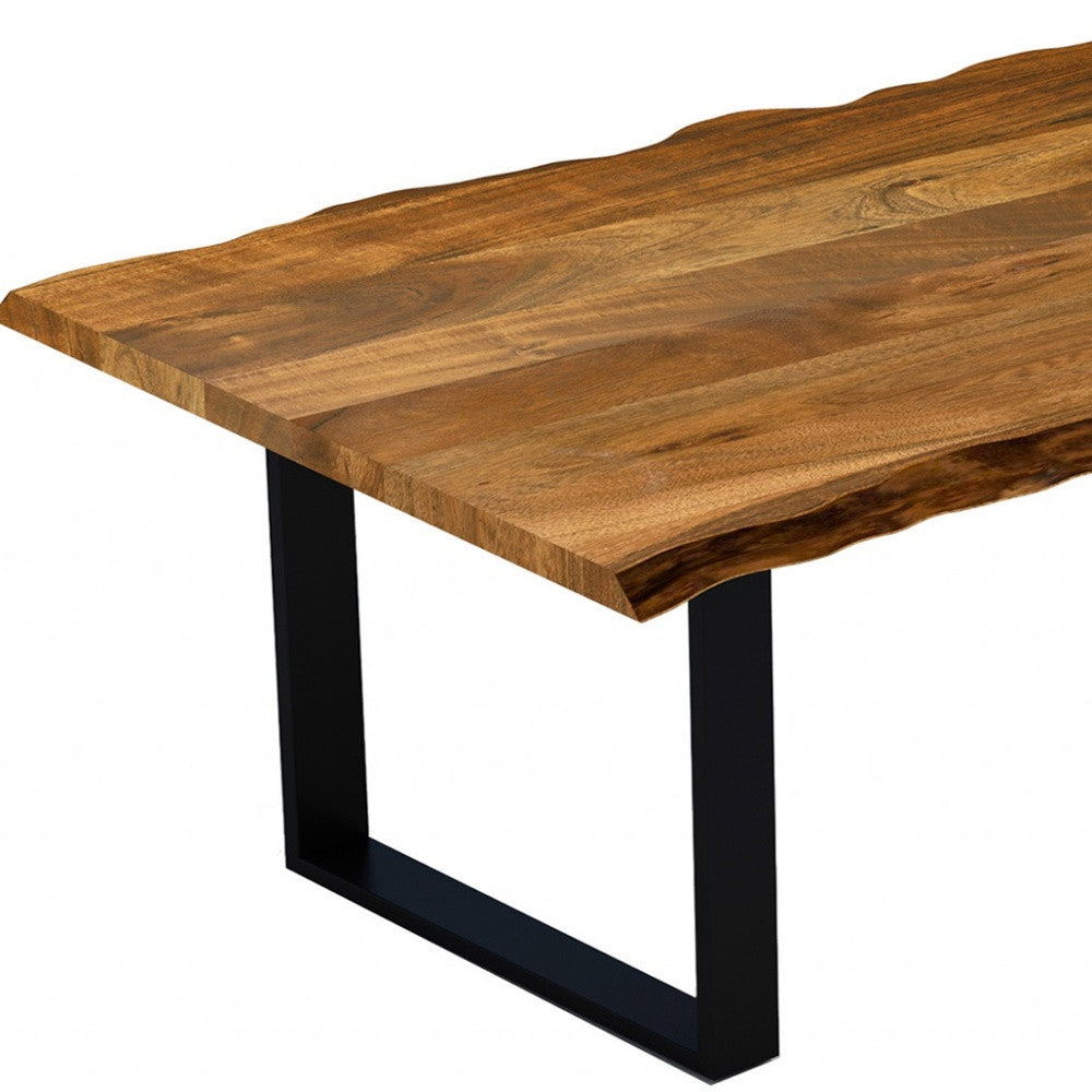 A 63-inch modern rustic dining table made of real acacia wood with a live edge design, featuring sturdy black metal legs.