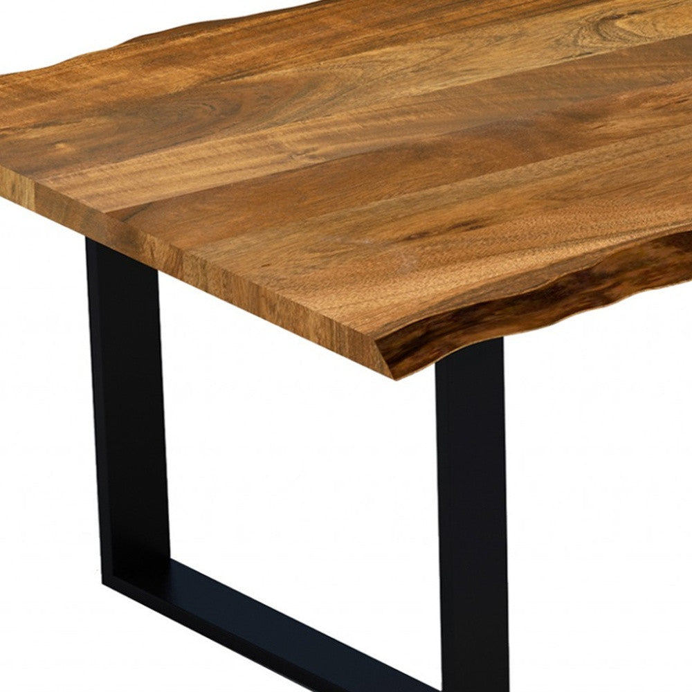 A 63-inch modern rustic dining table made of real acacia wood with a live edge design, featuring sturdy black metal legs.