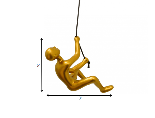 A detailed view of the Resin Gold Climbing Man wall art, showcasing its unique climbing design and elegant gold finish.