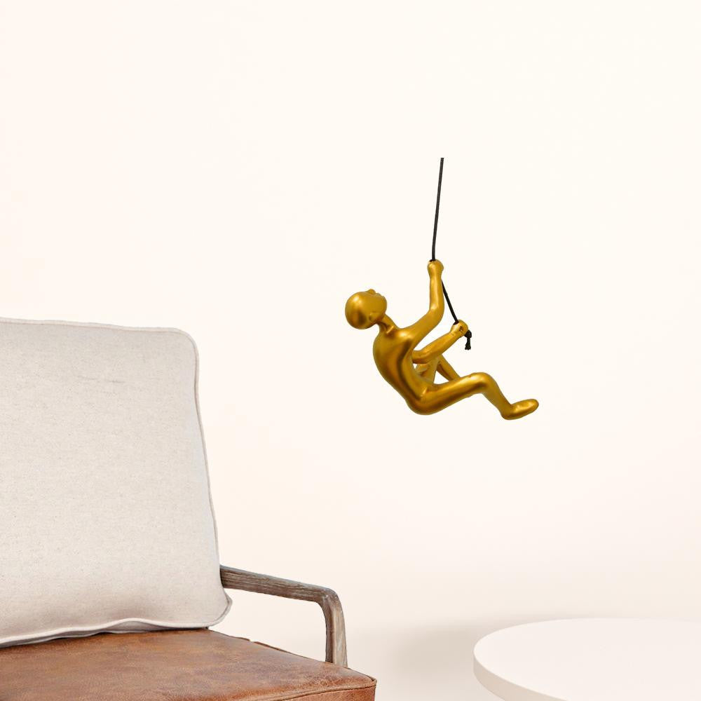 A detailed view of the Resin Gold Climbing Man wall art, showcasing its unique climbing design and elegant gold finish.