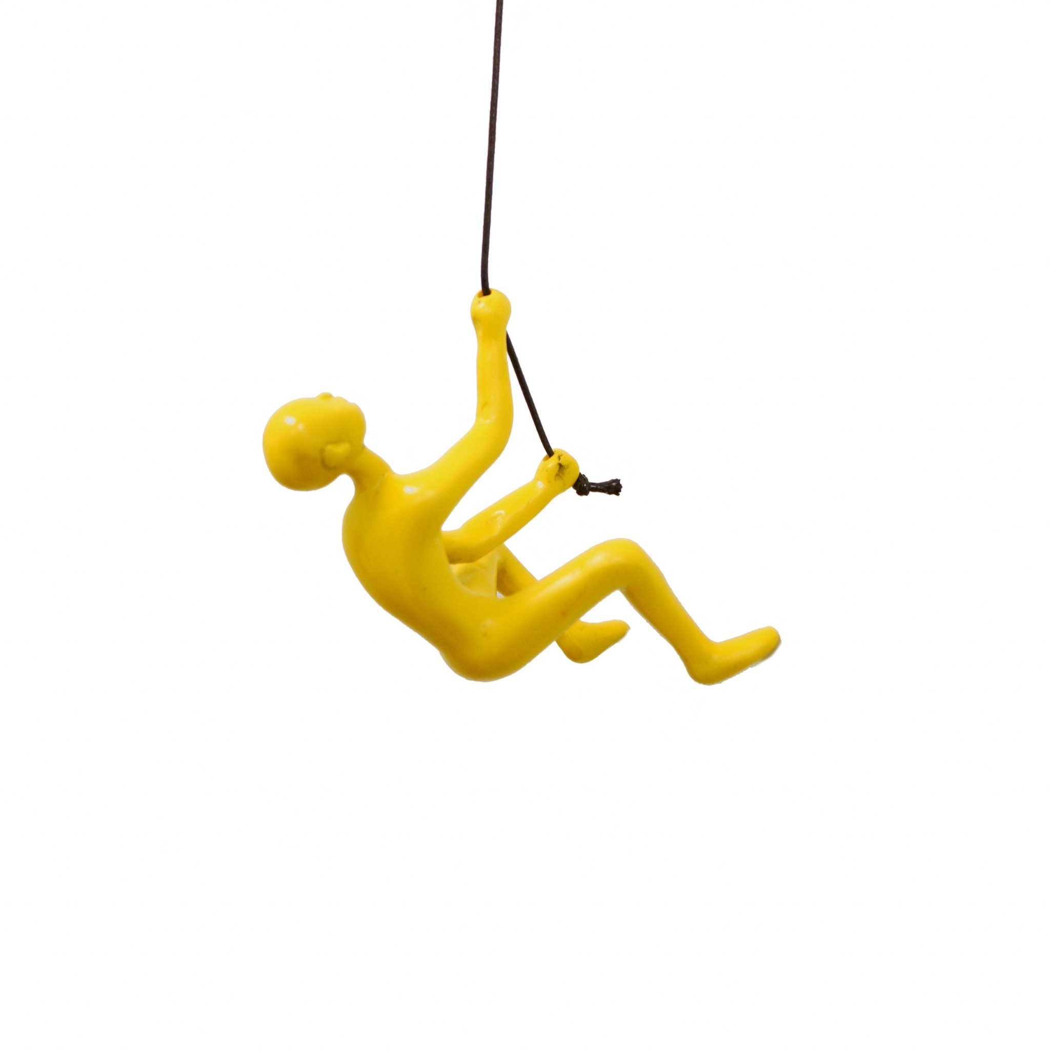 A vibrant yellow resin sculpture of a man climbing, designed for wall art decoration, showcasing a modern and unique aesthetic.