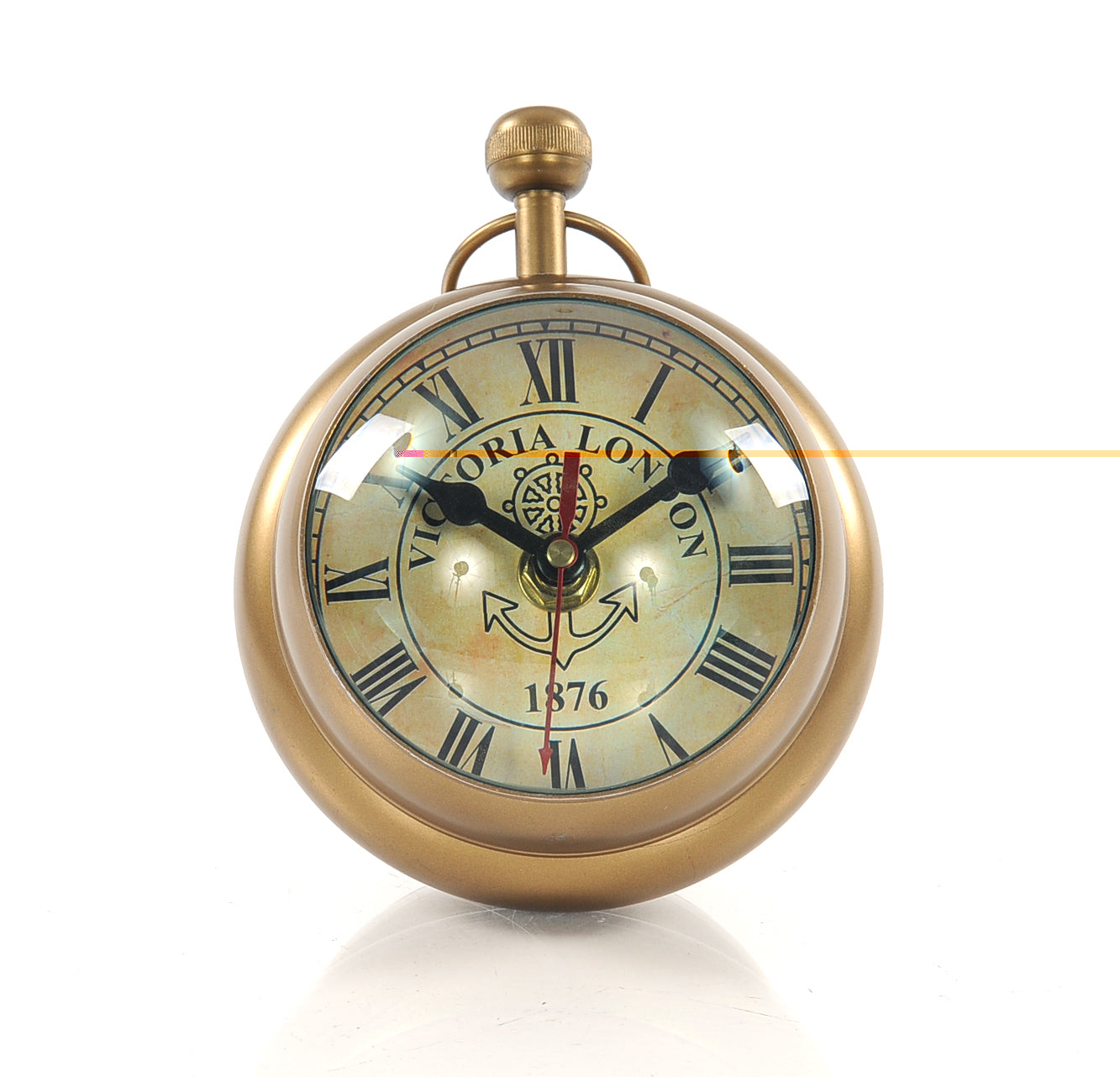 A vintage-style paper weight clock resembling a Victorian watch, featuring a Roman numeral clock on one side and a compass on the other, made of aluminum.