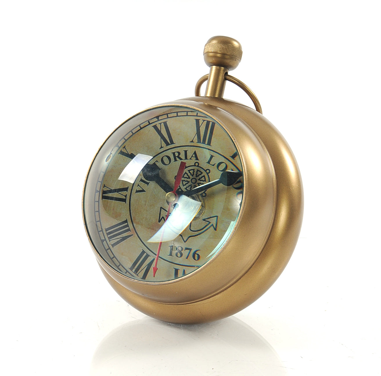 A vintage-style paper weight clock resembling a Victorian watch, featuring a Roman numeral clock on one side and a compass on the other, made of aluminum.