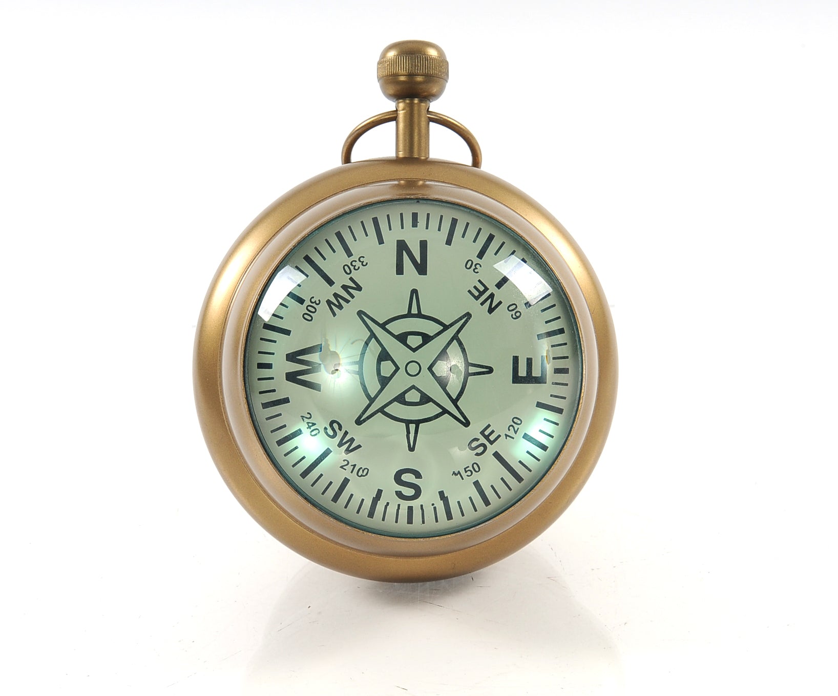 A vintage-style paper weight clock resembling a Victorian watch, featuring a Roman numeral clock on one side and a compass on the other, made of aluminum.