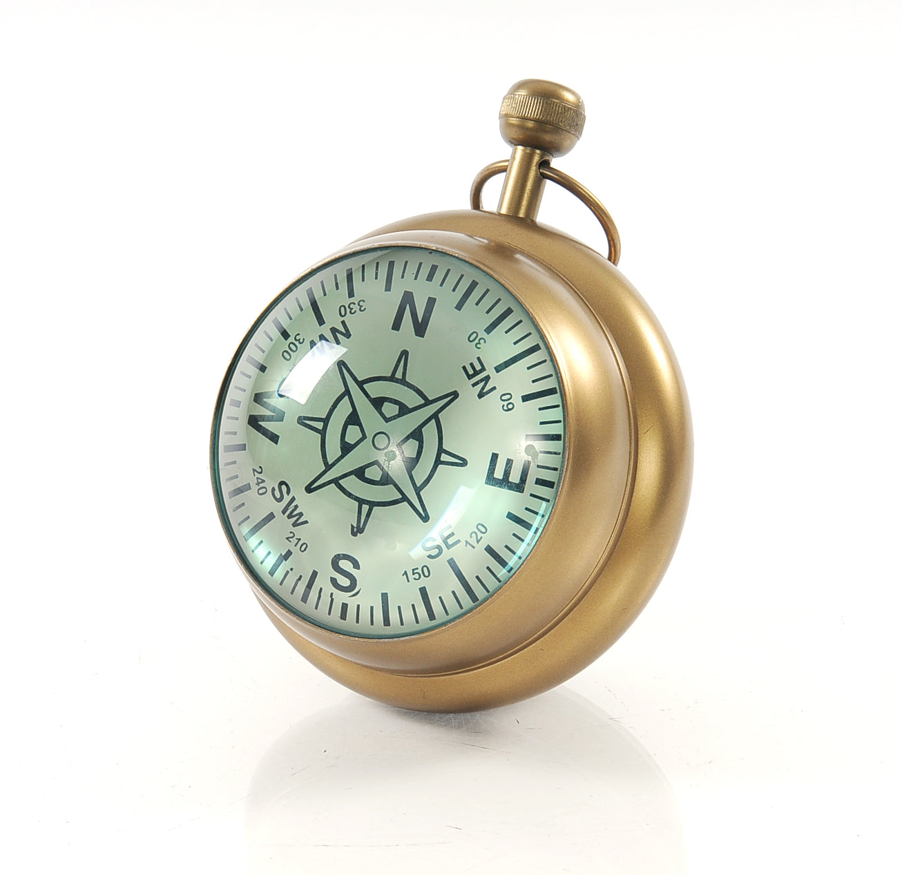 A vintage-style paper weight clock resembling a Victorian watch, featuring a Roman numeral clock on one side and a compass on the other, made of aluminum.