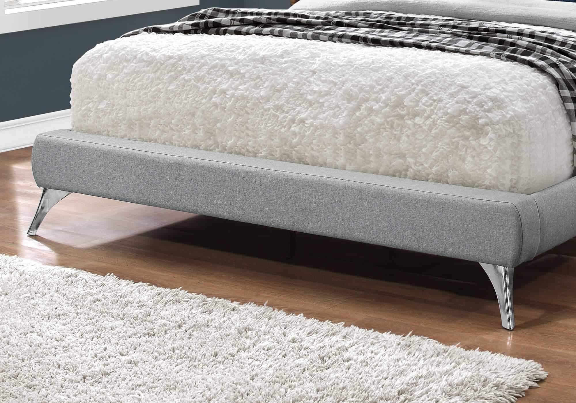 A stylish grey foam queen-sized bed with solid wood frame and linen upholstery, showcasing modern design and comfort.