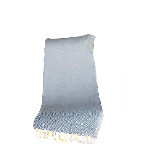 A 70-inch blue geometric handwoven throw blanket displayed elegantly on a couch, showcasing its intricate patterns and high-quality cotton material.