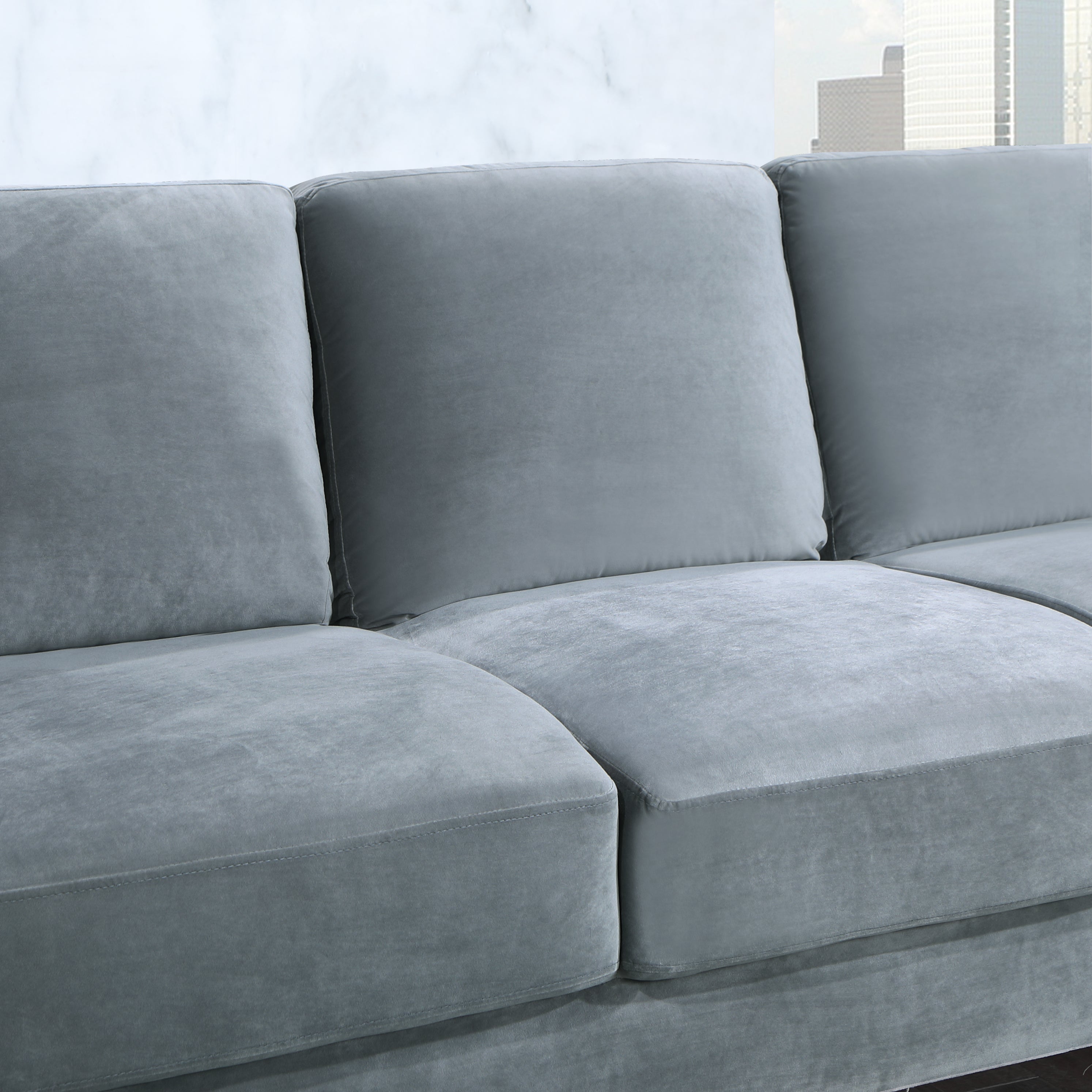 A stylish 73.22inch 3 seater sofa upholstered in soft velvet grey fabric, showcasing its modern design and comfortable seating.