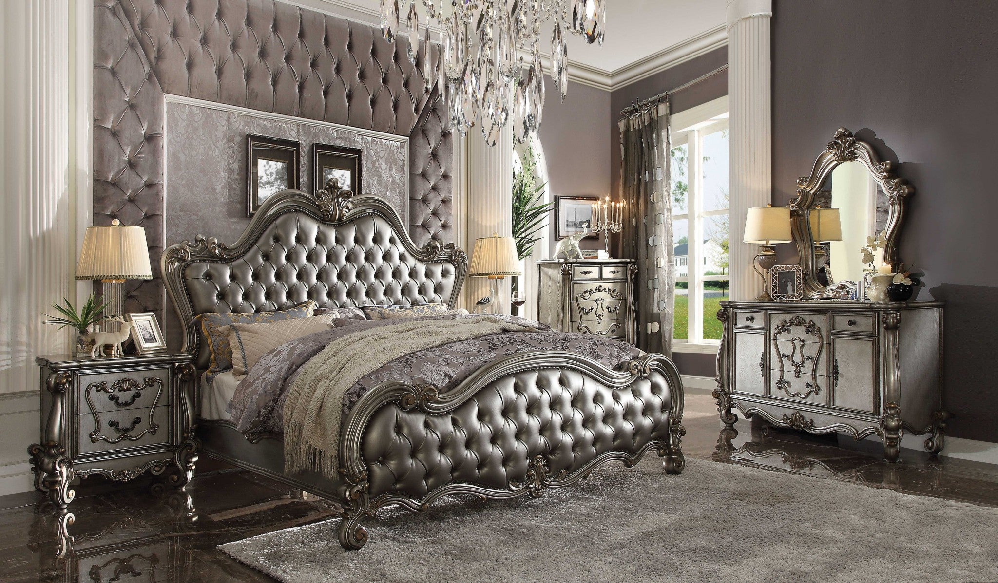 Luxurious 73x99x72 inches Silver PU Antique Platinum Upholstery bed set featuring carved scrollwork and tufted upholstery.