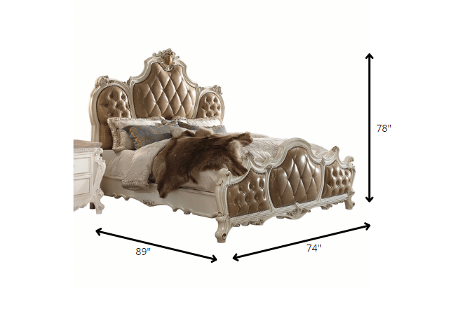 Elegant 74x89x78 PU Antique Pearl Wood Poly Resin bed with tufted upholstery and intricate carvings.