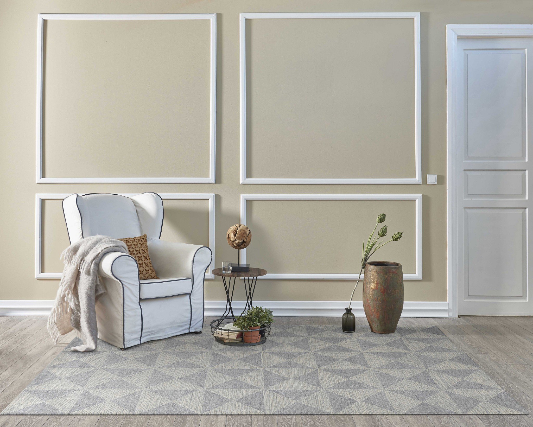 A luxurious 78 x 114 ivory wool rug, hand-tufted with a soft texture, perfect for enhancing living room decor.