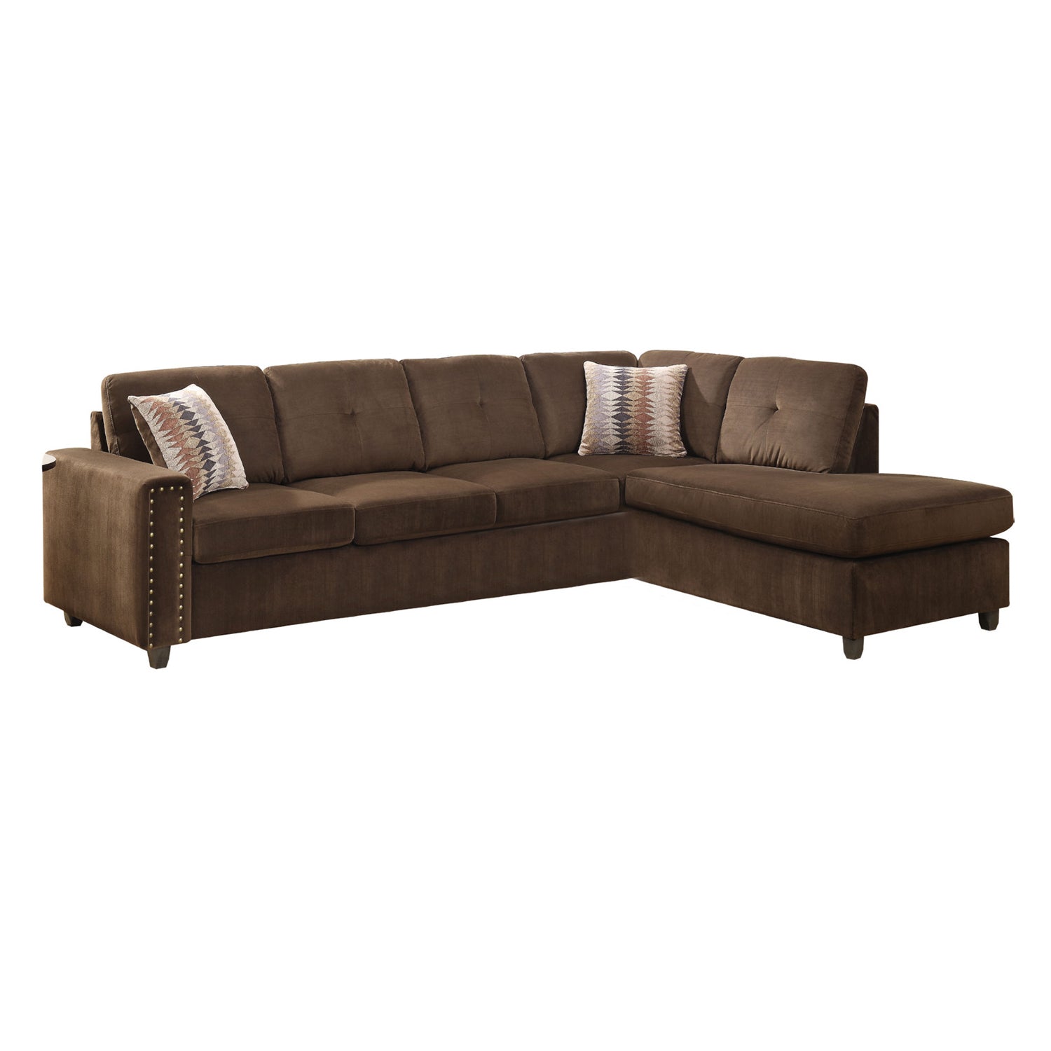 Chocolate velvet reversible sectional sofa with tufted cushions and track armrests, featuring two square pillows and an ottoman.