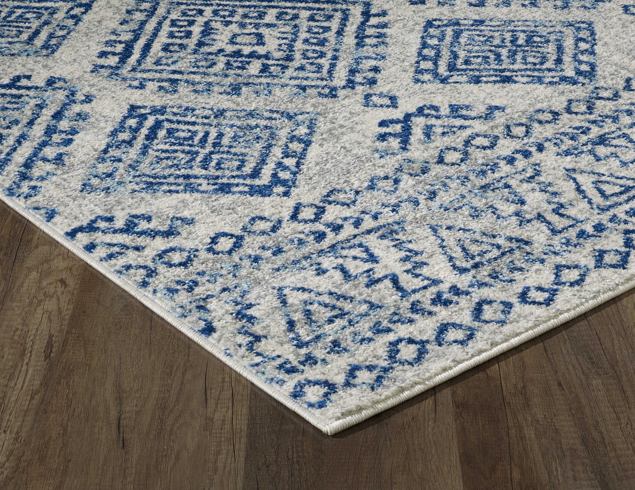 7-inch ivory blue machine woven distressed geometric indoor runner rug, showcasing a modern design with soft textures.