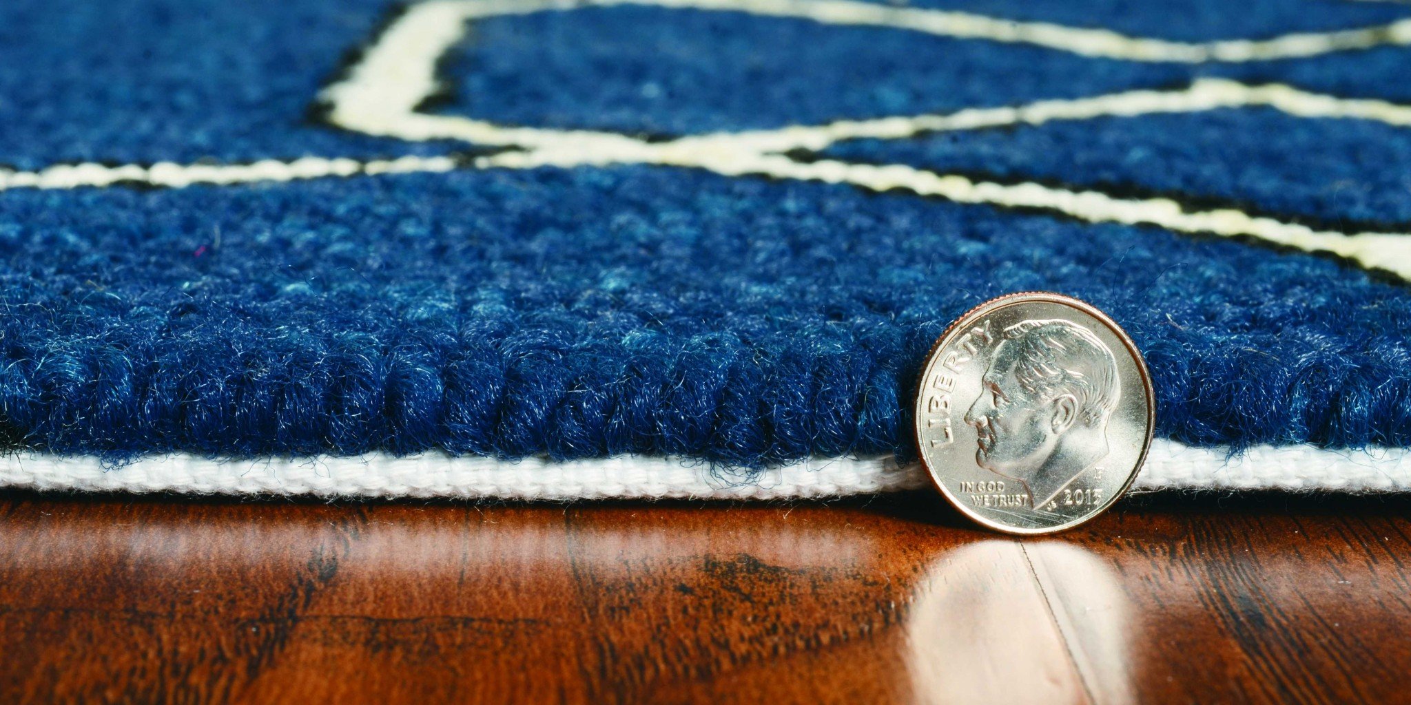 7-inch navy blue hand-hooked geometric round rug, showcasing intricate patterns and UV-treated polypropylene material, suitable for indoor and outdoor use.