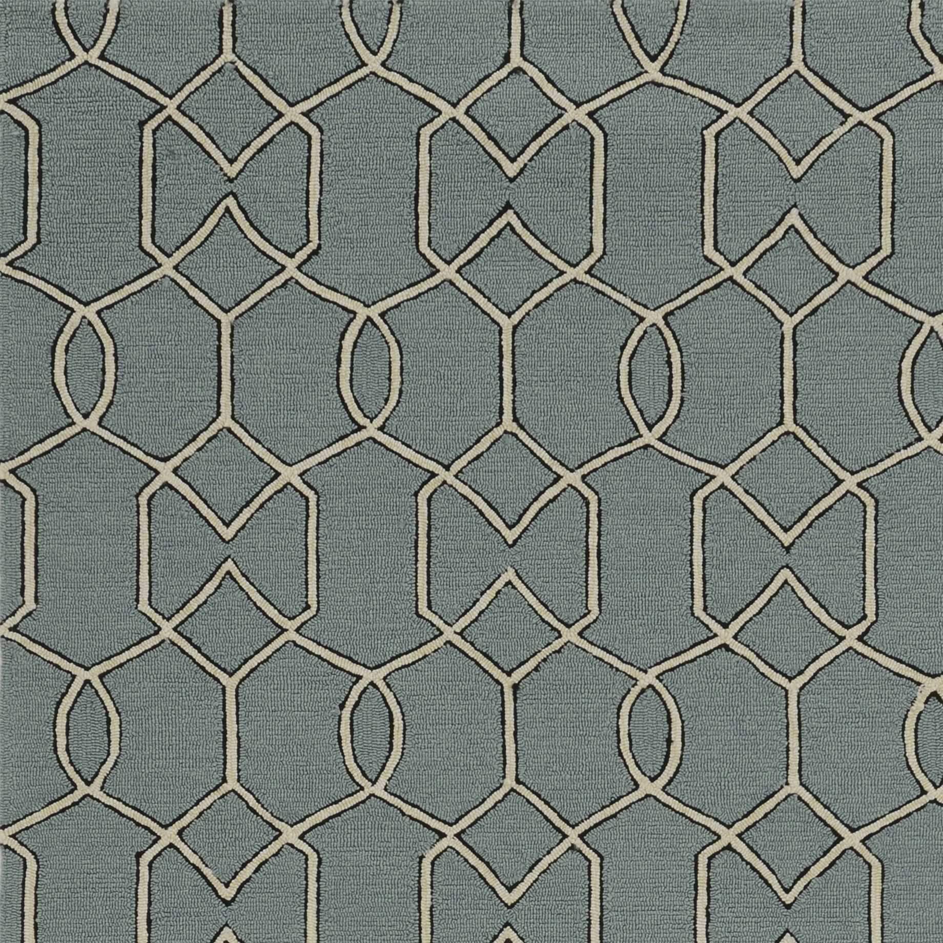 7-inch Spa Green Hand Hooked UV Treated Geometric Round Indoor Rug displayed on a wooden floor, showcasing its vibrant color and unique design.