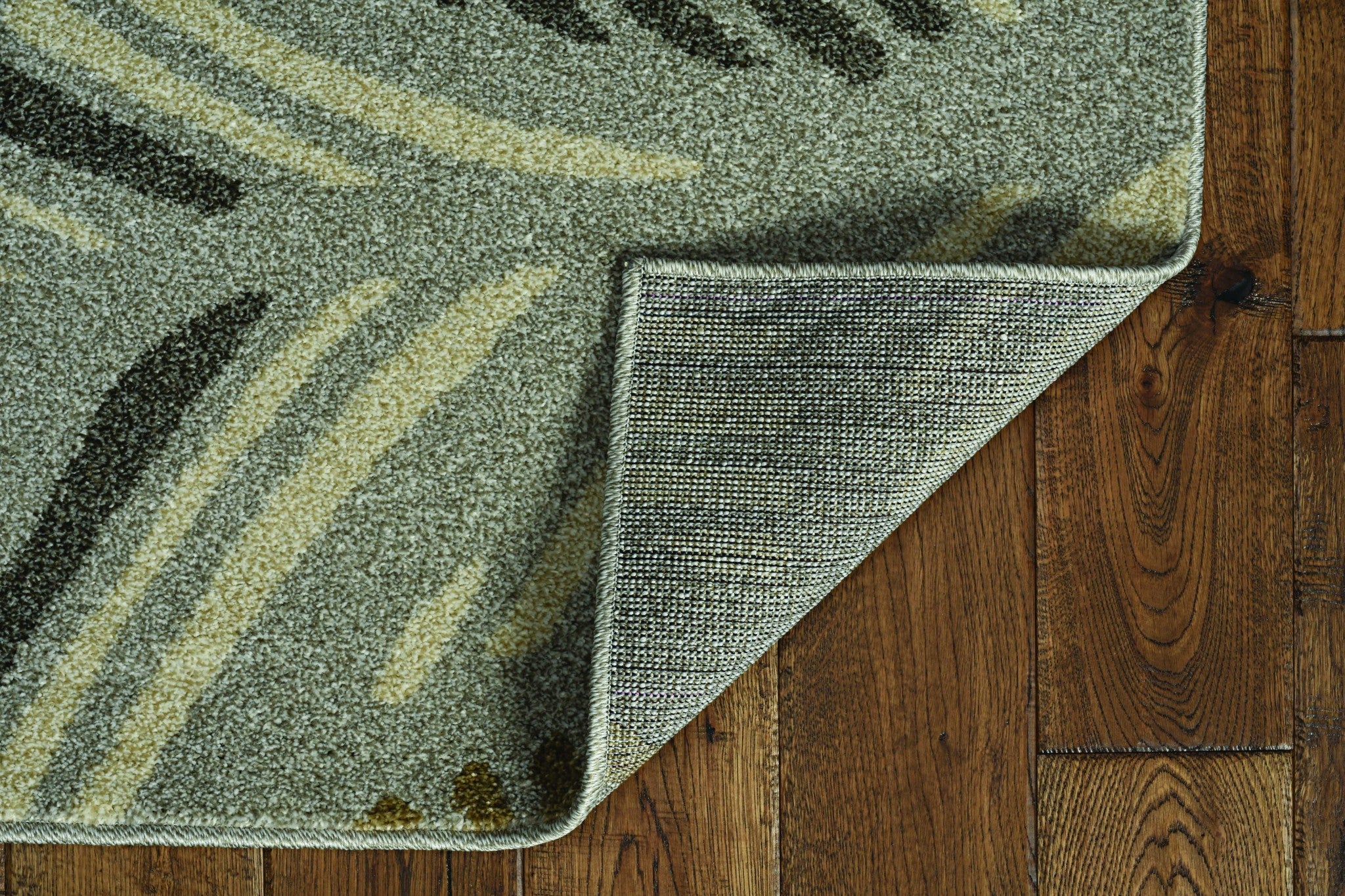 7x9 grey feather pattern area rug suitable for indoor and outdoor use, showcasing elegant design and durable material.