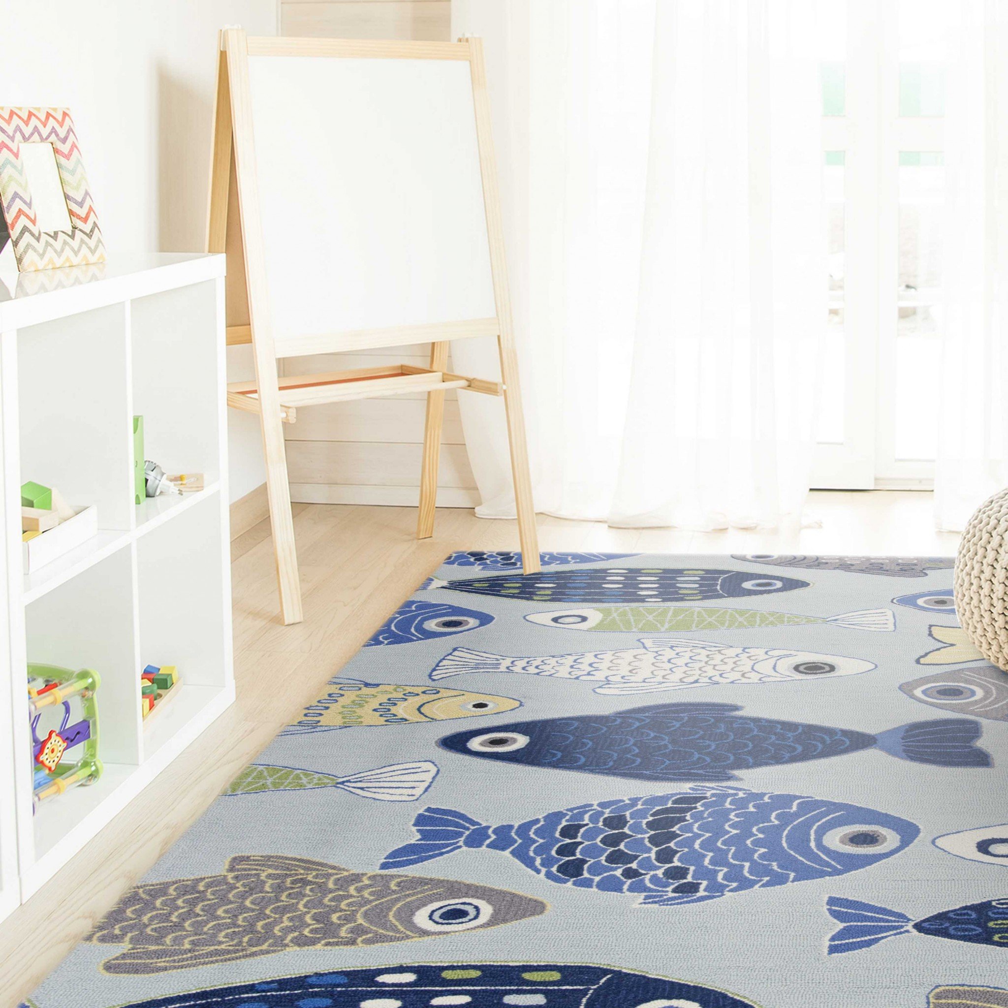 A beautiful light blue area rug measuring 7x9 inches, hand-hooked from polyester with a cotton backing, showcasing a modern design.