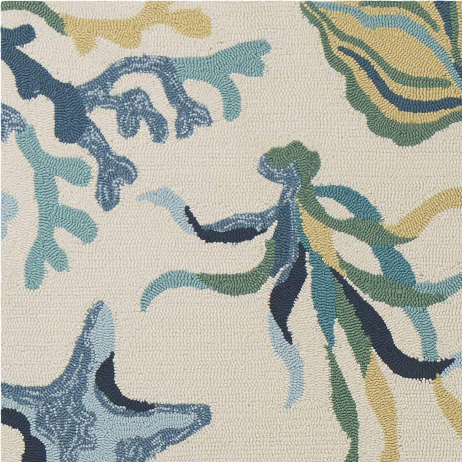 7x9 UV treated polypropylene area rug in ivory and blue, showcasing modern paint-dripping effects and layered designs.