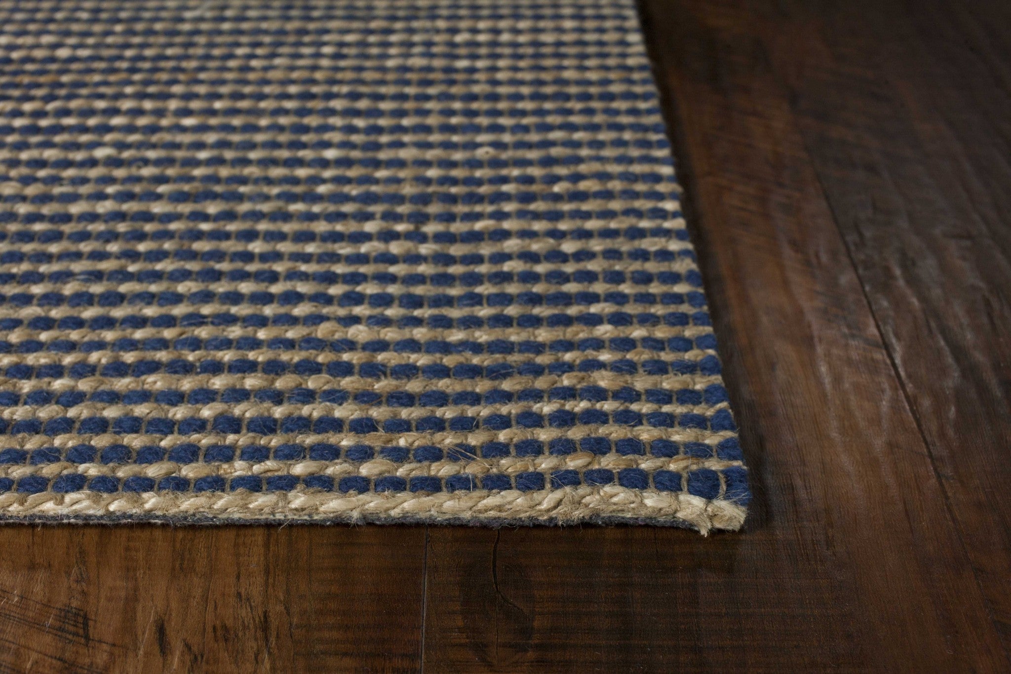 A beautifully crafted 7x10 inches blue hand-woven wool and jute indoor area rug, showcasing intricate textures and a contemporary design.