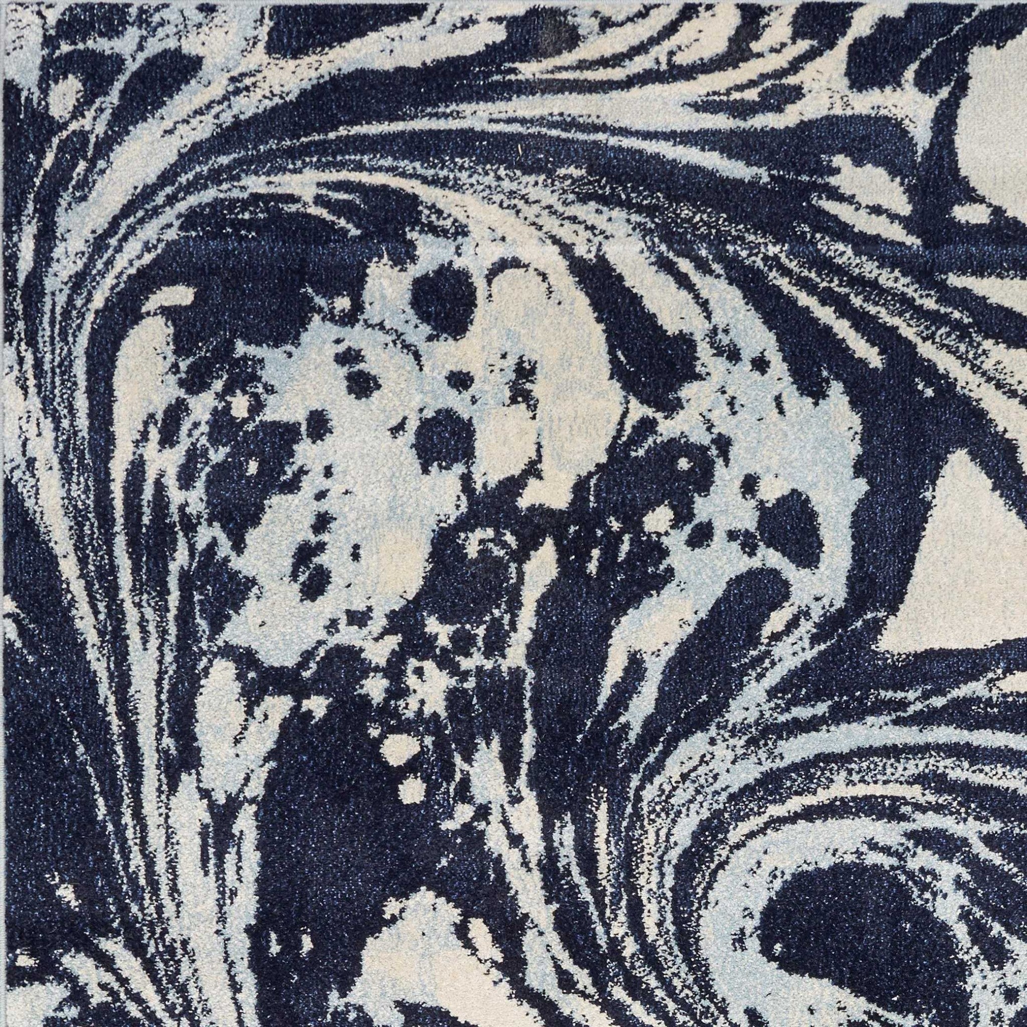 7x10 blue machine woven abstract indoor area rug featuring unique watercolor designs and a soft pile height, perfect for living rooms.