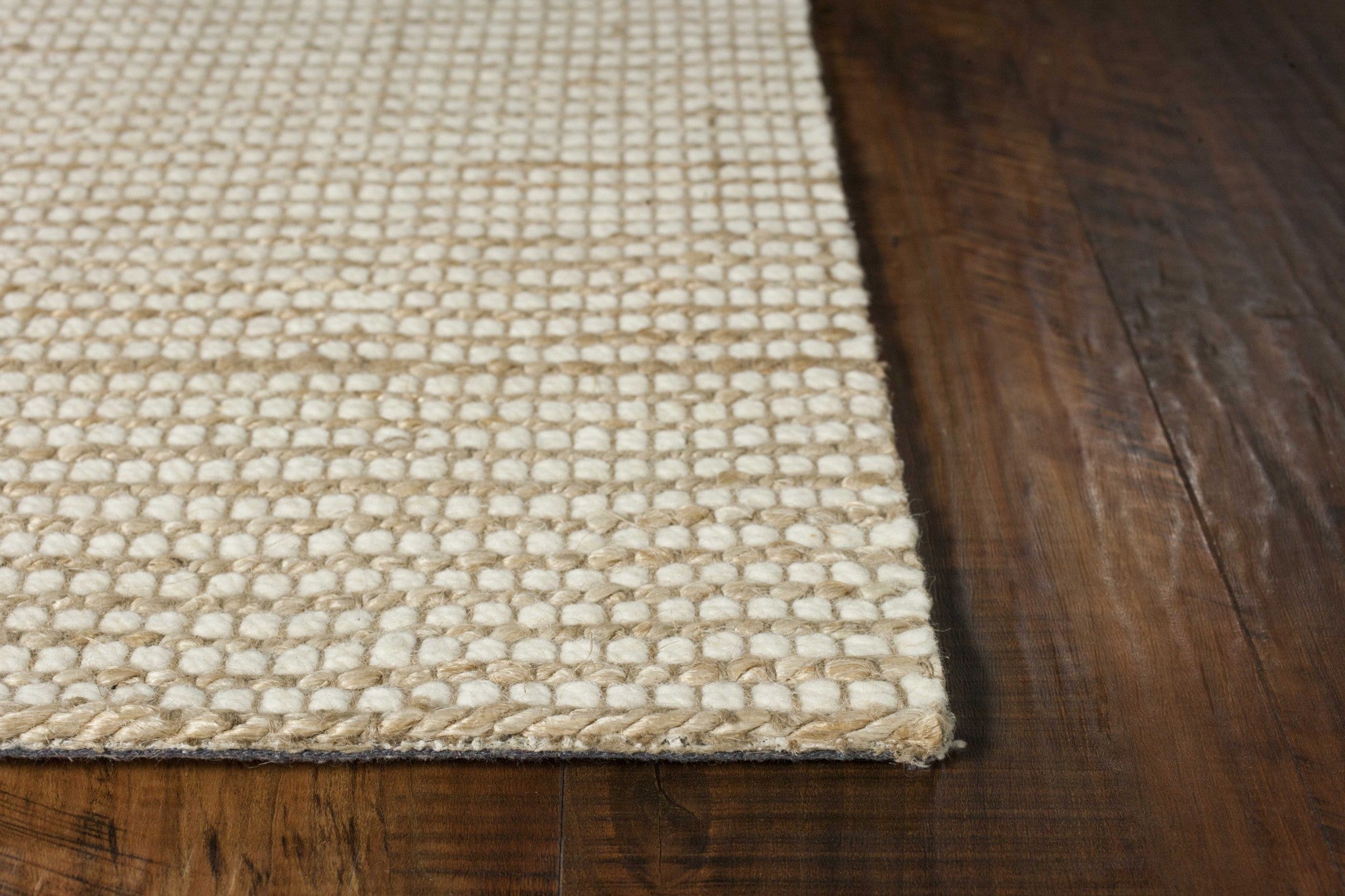 7 inches x 10 inches ivory hand-woven wool and jute indoor area rug, showcasing a textured surface and neutral color, perfect for any room.