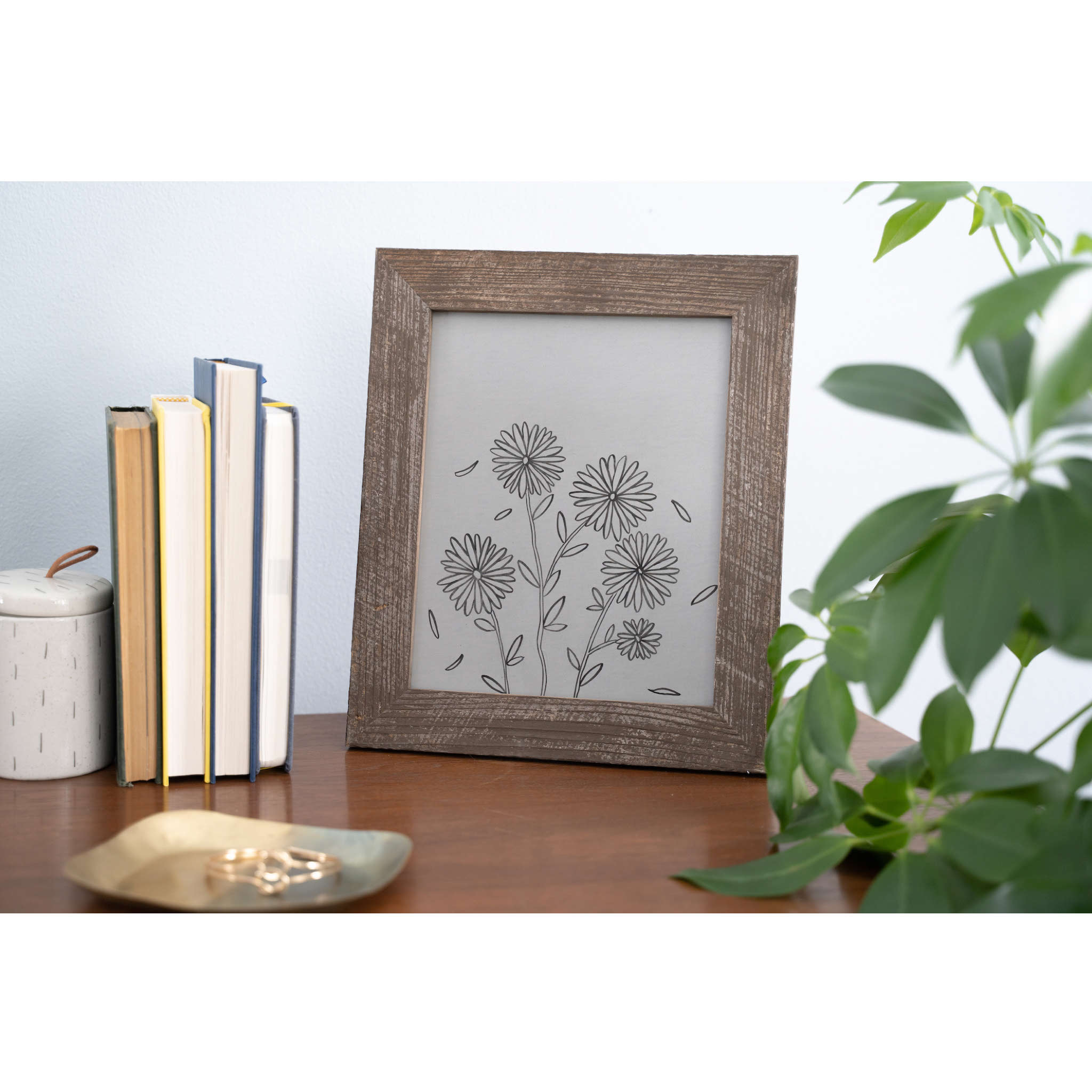 A rustic espresso picture frame made from reclaimed wood, designed to hold an 8.5x11 photo, showcasing its unique texture and warm brown color.