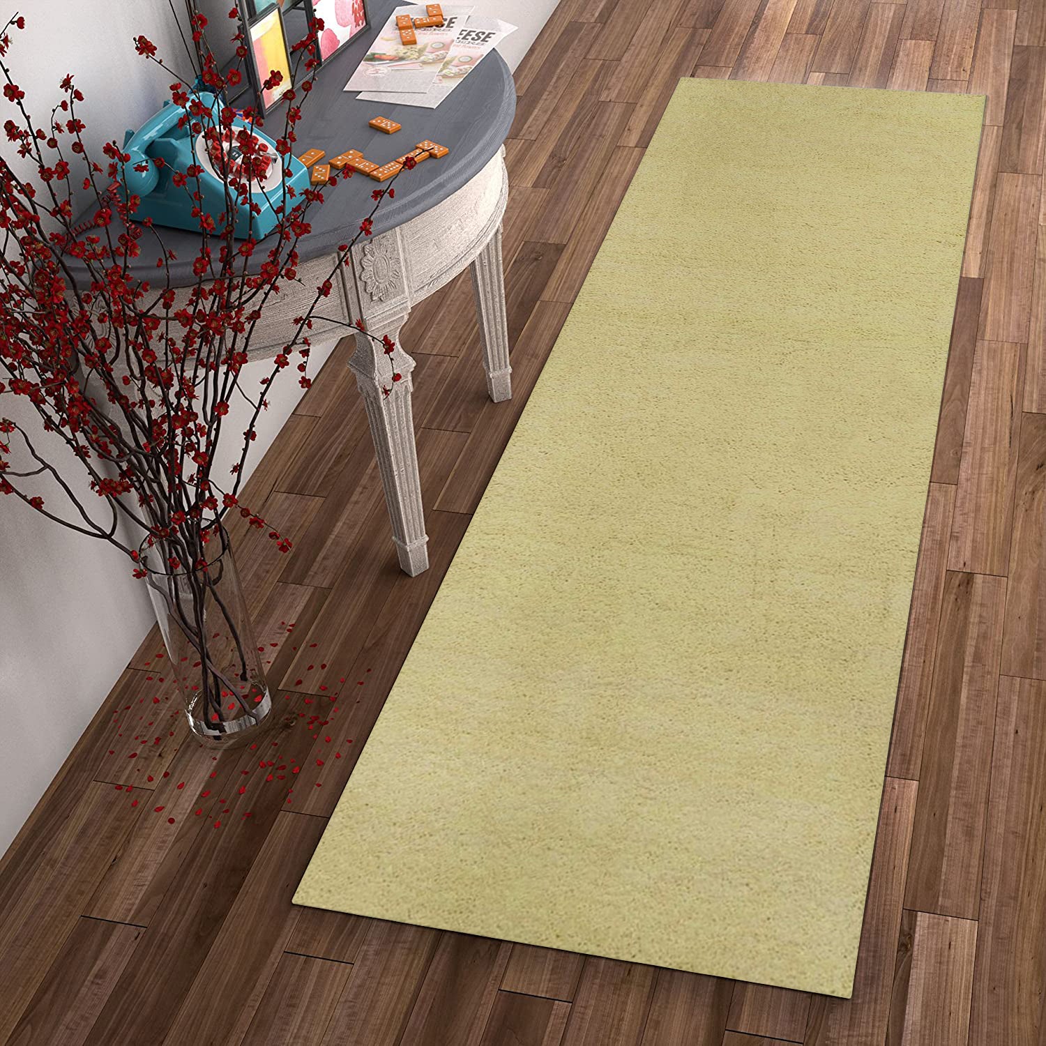 A vibrant canary yellow plain runner rug, hand woven from high-grade polyester with a cotton backing, perfect for enhancing home decor.