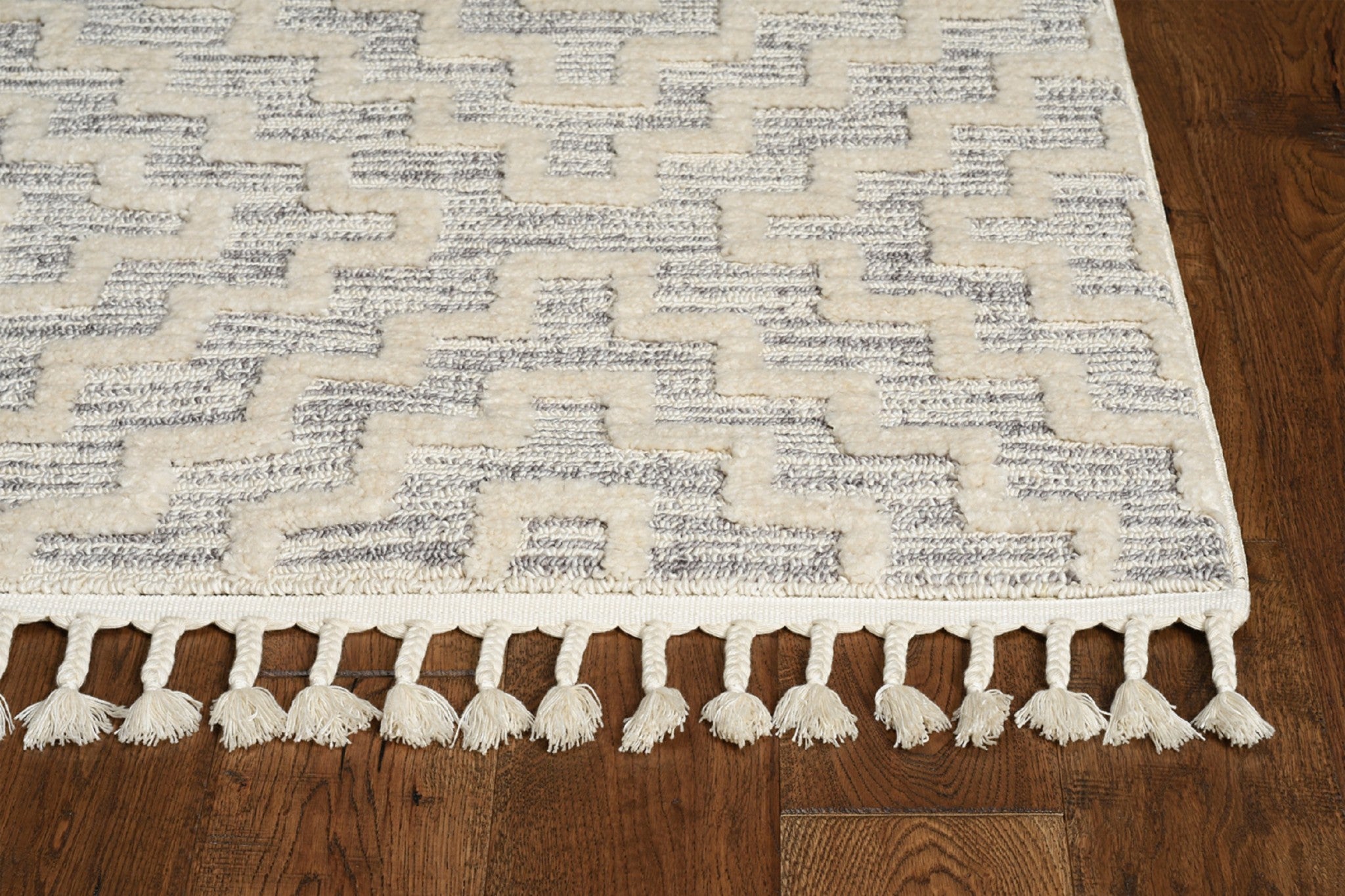 8-inch ivory grey machine woven geometric indoor runner rug with fringe detailing, showcasing a contemporary design.