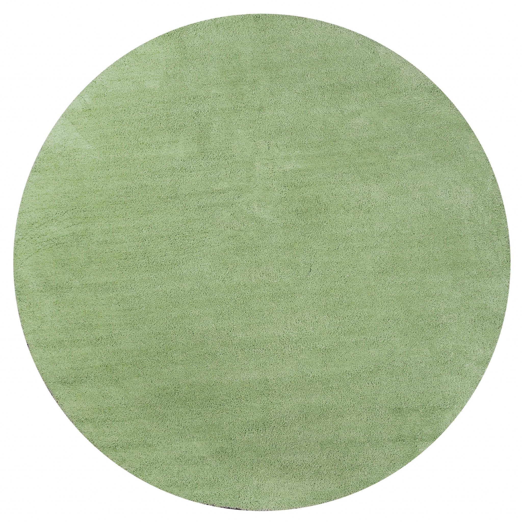 A vibrant 8-inch spearmint green round indoor shag rug, showcasing a plush texture and modern design, perfect for enhancing home decor.