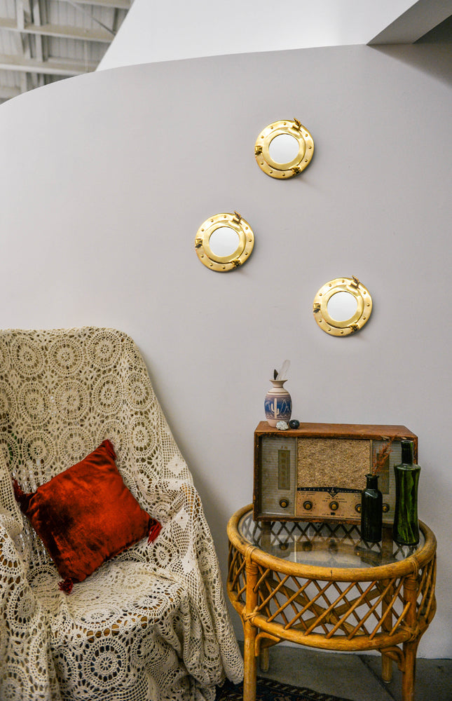 8x9.5 inch Porthole Mirror with solid brass frame and hinged design, perfect for nautical-themed decor.