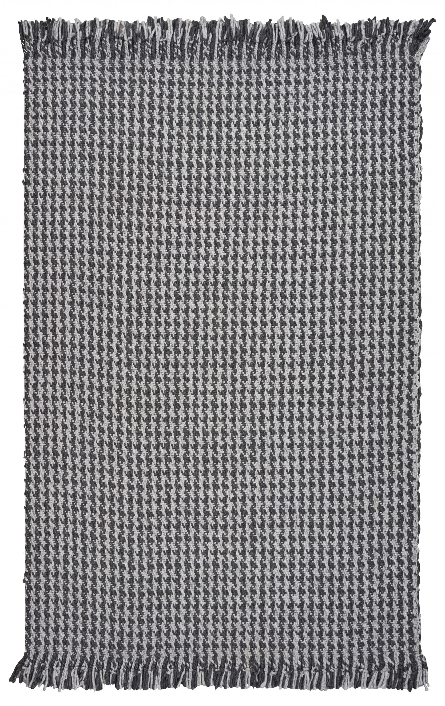 A beautifully crafted 8x10 grey hand woven houndstooth indoor area rug featuring a modern design and braided fringe, perfect for enhancing home decor.