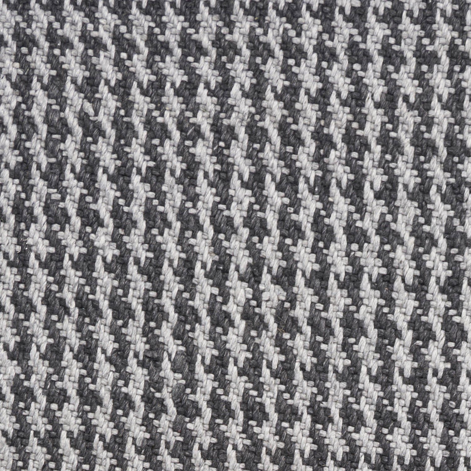 A beautifully crafted 8x10 grey hand woven houndstooth indoor area rug featuring a modern design and braided fringe, perfect for enhancing home decor.