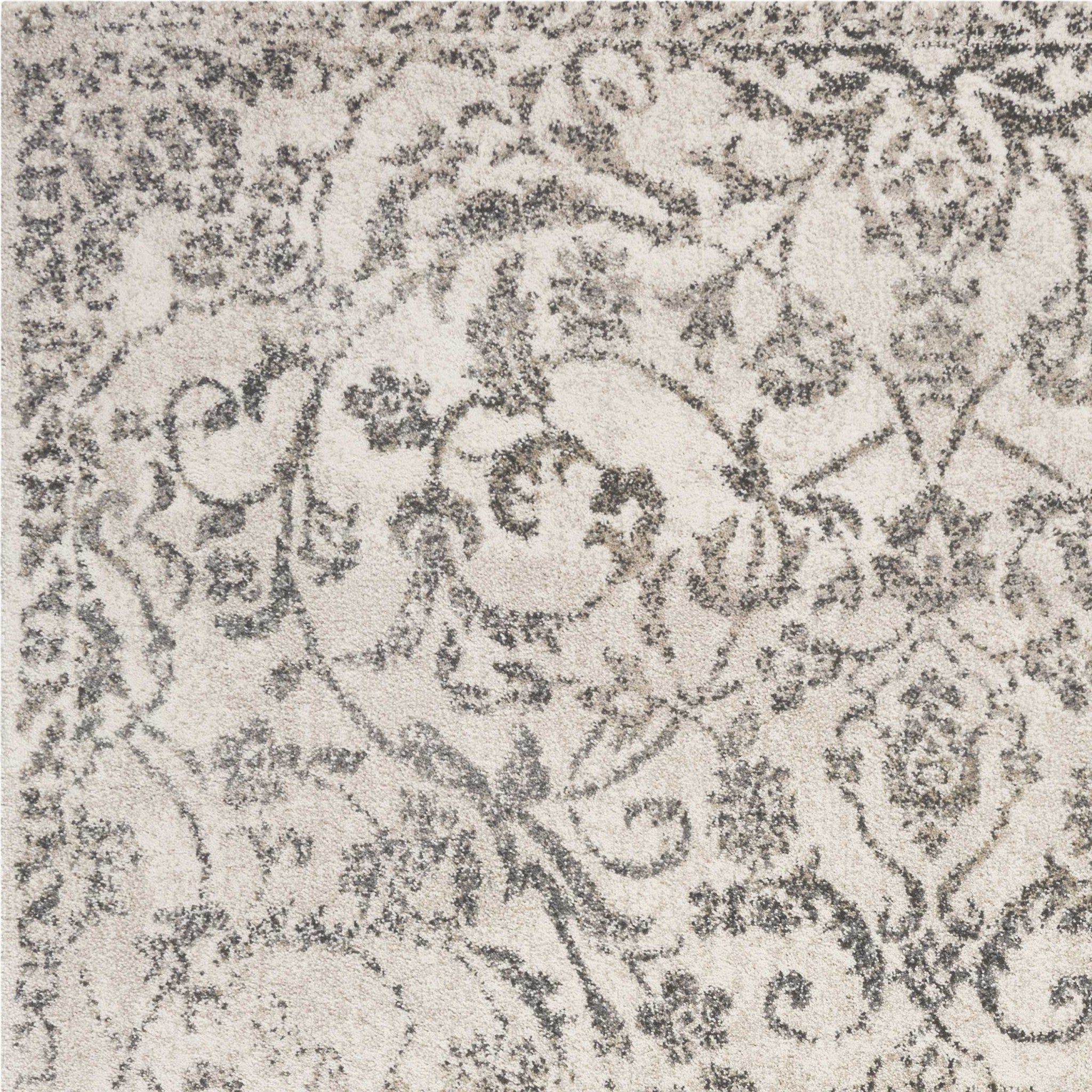 8x10 inches ivory machine woven rug featuring distressed floral vines design, perfect for indoor spaces.