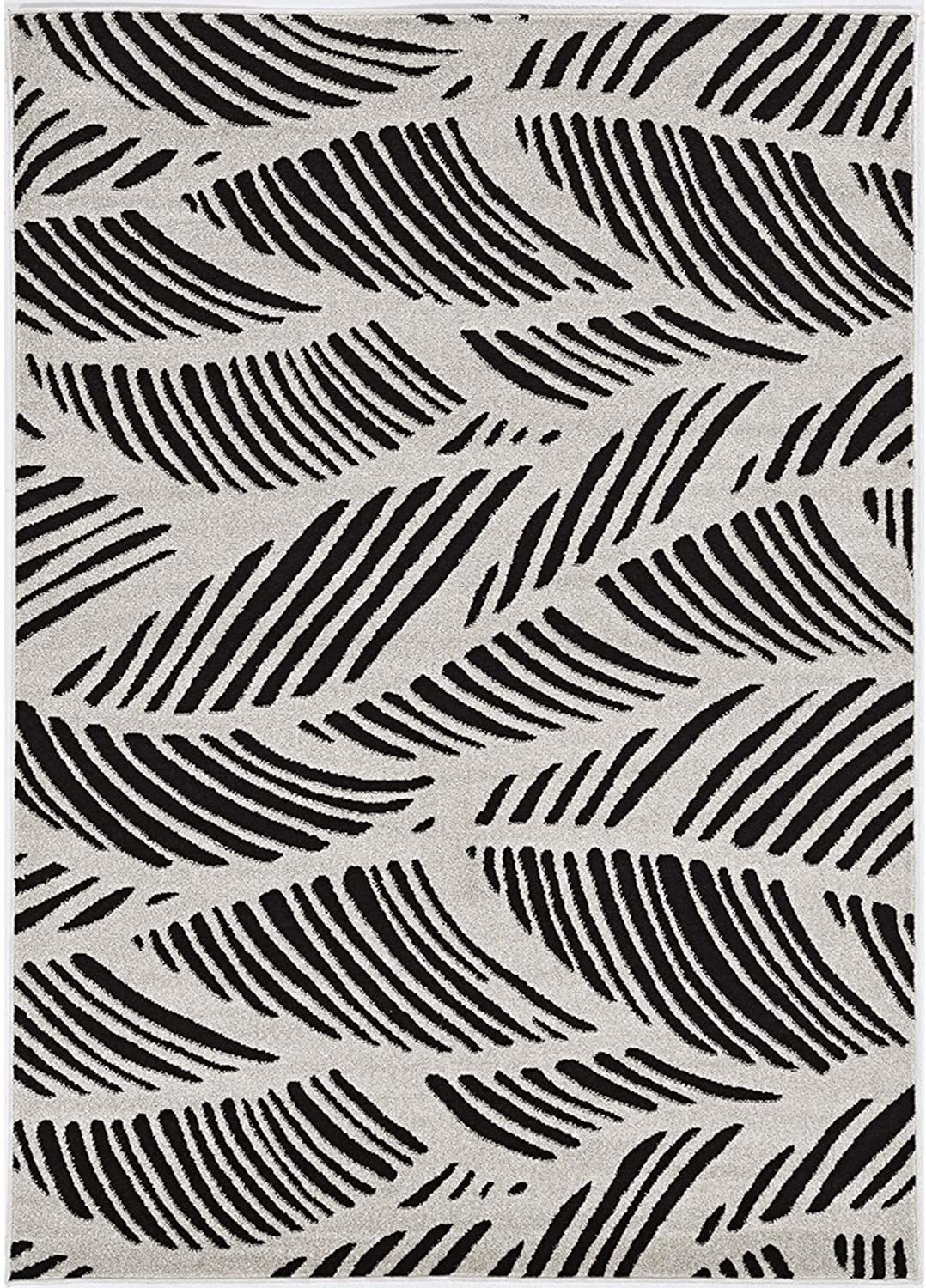 8x11 inches black and white machine woven outdoor rug featuring tropical palm design, made of UV-treated polypropylene.