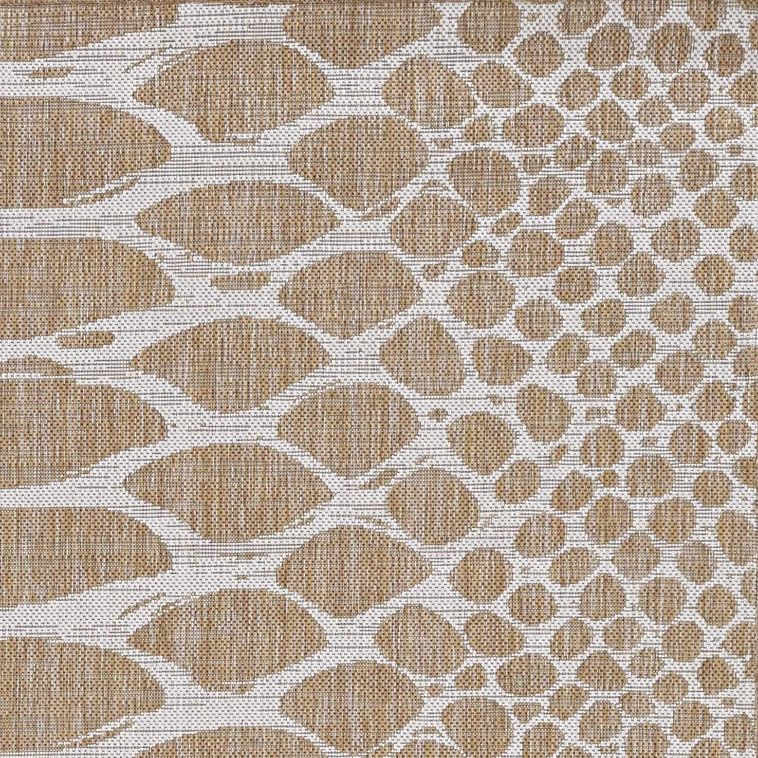 Ivory machine woven UV treated snake print rug, showcasing a stylish design suitable for indoor and outdoor use.