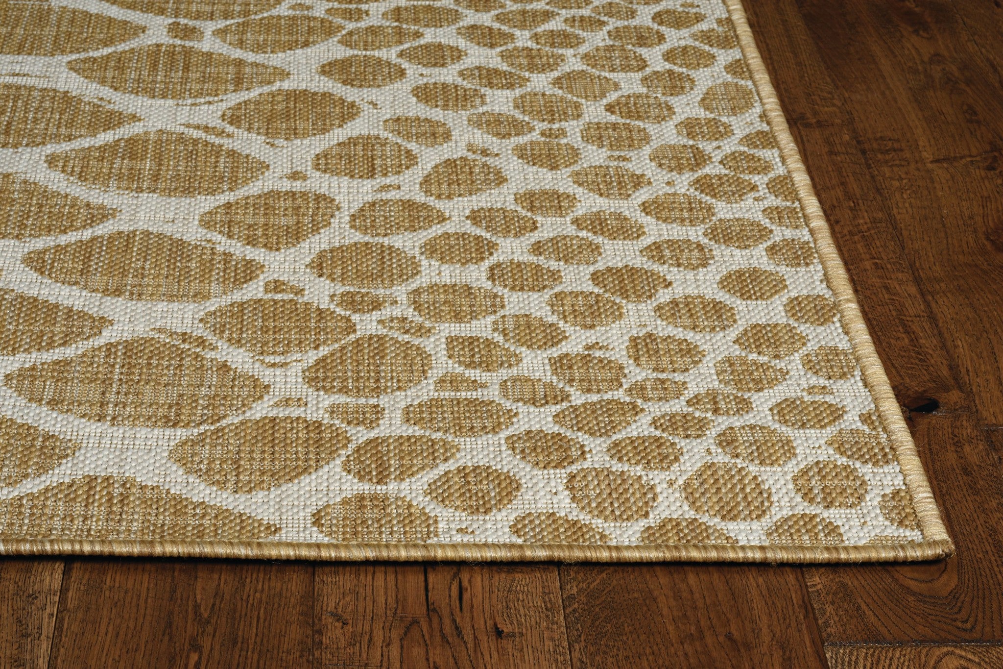 Ivory machine woven UV treated snake print rug, showcasing a stylish design suitable for indoor and outdoor use.