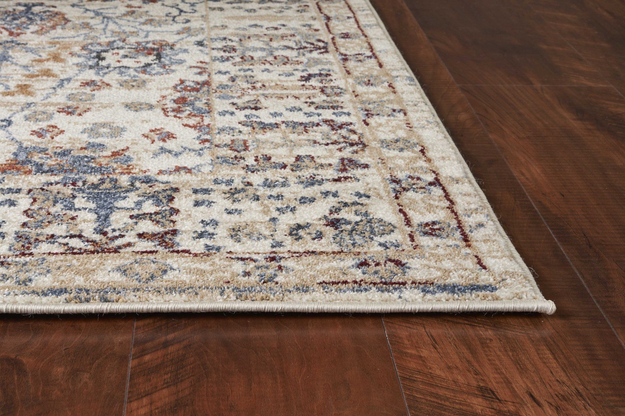 A large 91" x 130" beige polypropylene rug featuring vintage patterns, perfect for enhancing home decor.