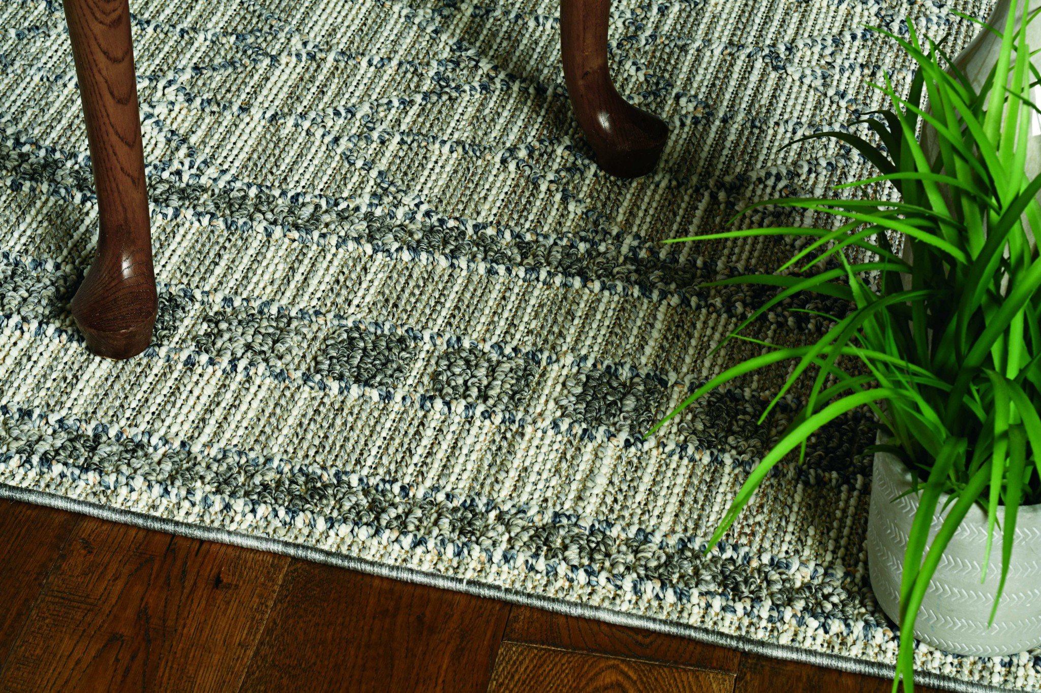 A stylish 91" X 91" pewter polypropylene rug featuring vintage patterns and trendy colors, perfect for enhancing home decor.